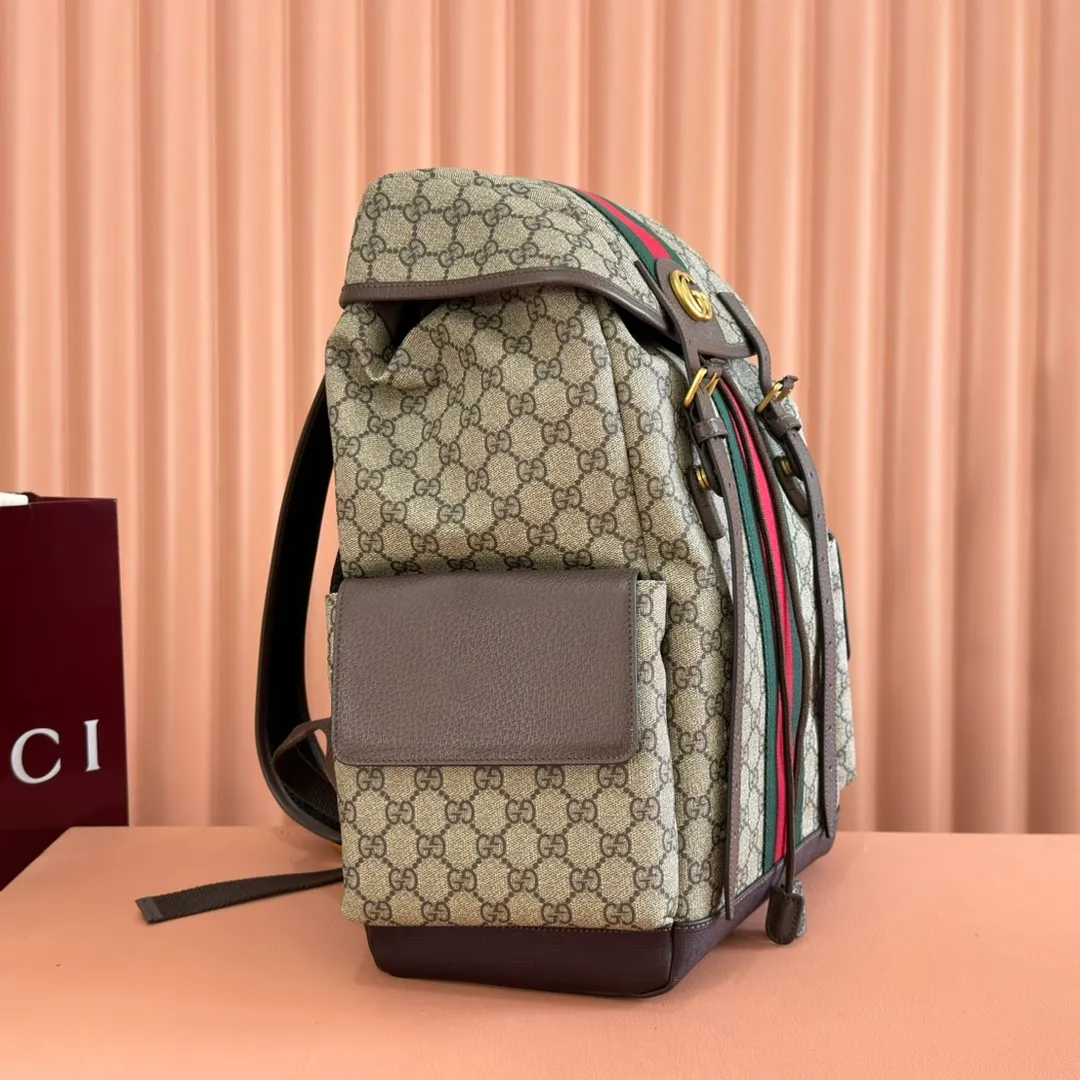 p1280. 🔥🔥🔥【With full set of original green gift bag】Ophidia series medium GG backpack. The 2024 early spring series renews the Ophidia series shoulder bags, tote bags and handbags in black GG denim, and the silver-toned accessories present a contrasting metallic texture. This Ophidia backpack in blue and black GG Supreme canvas demonstrates Gucci's design prowess in infusing the brand's iconic design elements with a modern appeal. Blue and black GG Supreme canvas, black leather piping, palladium tone hardware, cotton and linen blend lining, black mesh Double G on the back, flap side pockets with magnetic closure, inner phone pocket and padded tablet sleeve, adjustable shoulder strap, black mesh back, drawstring flap design, leather buckle fastening strap and extra magnetic buckle for easy opening and closing, weight: approx. 1.272 kg. Model: 598140. Dimensions: 40(length) x 24(width) x 16cm(thick) Color: Brown/PVC. Made in Italy
