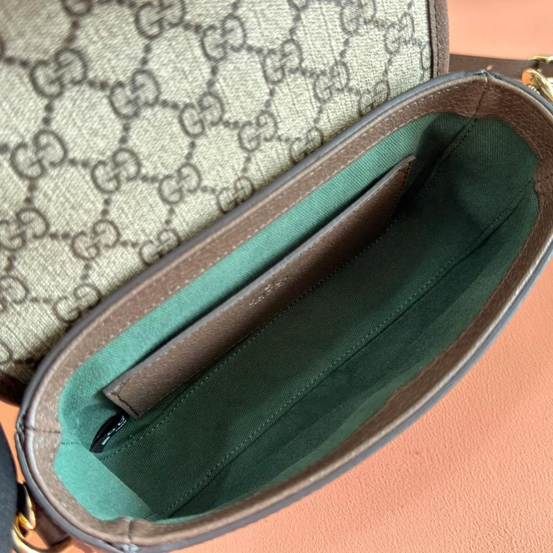 p960. 💋💋💋"With full set of original counter packaging"💋[New Product] The Ophidia series dazzlingly presents novel silhouettes and functions. It is ingeniously interpreted in iconic beige and brown colors to create a new bag item with soft texture. Beige and dark brown GG canvas Ankara red leather trim Light gold tone hardware Green cotton lining Double G Interior: One open pocket Carry handles (2.5 cm high) Removable and adjustable leather shoulder strap (height: 46 cm to 54 cm; length: 101 cm to 116 cm) Ident.: 836843. Dimensions: 20cm (width) x 16cm (height) x 5cm (depth) Weight: approx. 0.55kg Color: brown pvc. Made in Italy