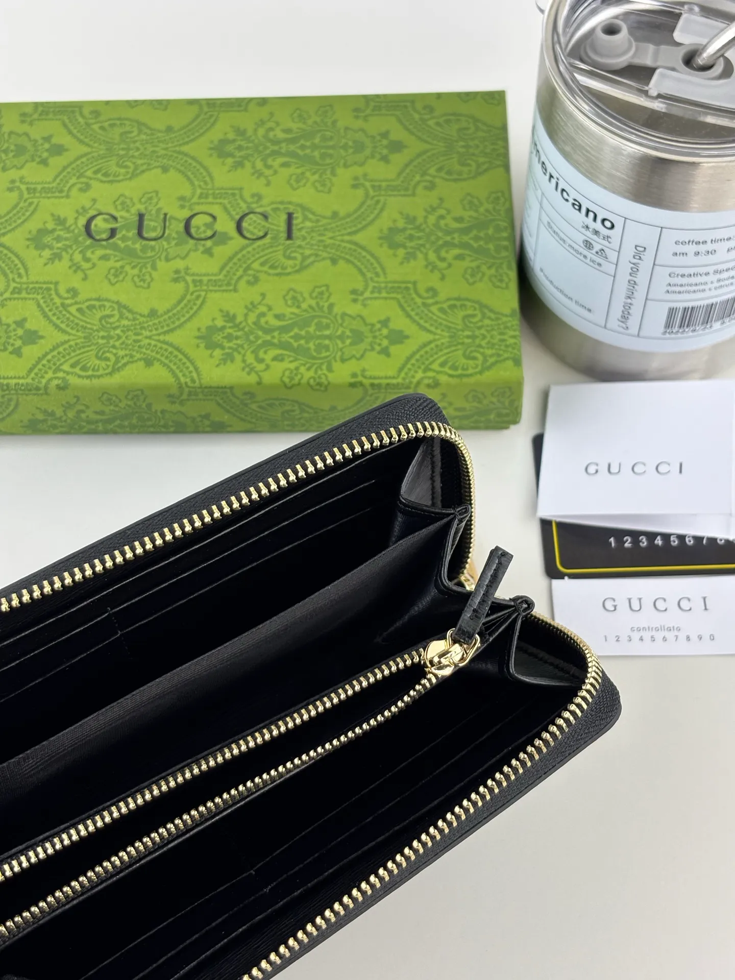 💰170 GUCCl Long zipper wallet with handwritten Gucci logo. Exploring self-expression with unlimited possibilities has become the spiritual connotation of brand design. Crafted from black leather, this long clip is embellished with a gold-toned handwritten Gucci logo-shaped hardware, adding a touch of the brand's signature charm to the entire design. Black leather, gold-tone hardware, taffeta lining, script Gucci logo detail. Interior: Six card compartments, two bill compartments, two separate internal compartments and a zippered coin pocket, this classic piece features a zipper closure Style number: 772642 Dimensions: 19cm x 10cm x 3.5cm Colour: Black
