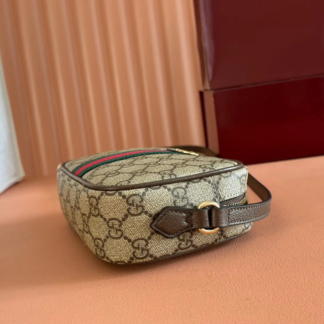 p960. 💋💋💋"With full set of original counter packaging" [New Product] Inspired by Gucci's iconic travel bag silhouette, the brand launched the Mini GG handbag. This handbag is crafted from soft GG presbyopic canvas and is equipped with web handles and a detachable shoulder strap. It reinterprets the brand's classic elements and pays homage to Gucci's proud travel tradition. Beige and dark brown GG monogram coated fabric Dark brown leather piping Light gold tone hardware Green linen cotton blend lining Carry handles (10cm high) Removable and adjustable leather shoulder strap (50cm high; Length: 101.5cm) Model: 859975. Dimensions: 20cm (W) x 13cm (H) x 13cm (D) Weight: approx. 0.4kg Colour: Brown/PVC. Made in Italy