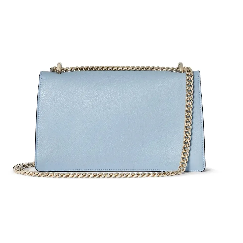 This piece is crafted from light blue leather and has a double tiger head lock with a flip design. The length can be adjusted freely by sliding the chain to create different styles. Light blue leather Light gold-tone hardware Light blue microfiber lining Pin buckle, side opening Double tiger head lock closure Internal zip compartment Flap pocket Double baffles Sliding chain shoulder strap can be adjusted to a shoulder strap with a height of 43 cm, or a top handle with a height of 24 cm. Weight: about 0.8 kg Model: 795005. Dimensions: 28cm (width) x 16cm (height) x 10.5cm (depth) Color: light blue full leather/original leather. Made in Italy