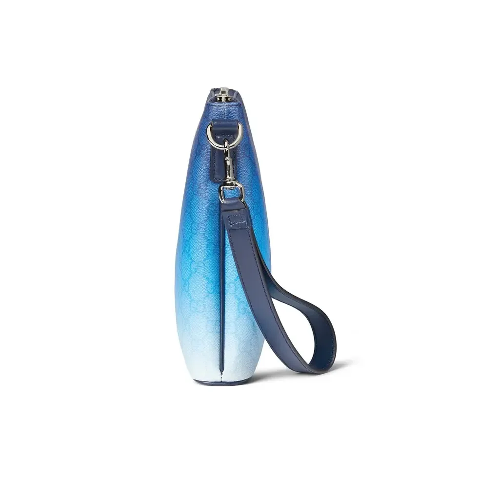 🔥The unique blue gradient effect print adds a fashionable aesthetic to this basic functional item. This clutch bag is made of GG Monogram coated fabric and has an all-over gradient print for an elegant style. Gradient blue GG Monogram coated fabric All-over gradient print Blue cotton and linen lining Interior: 1 zip pocket Detachable wrist strap (17 cm high) Zip closure Ref.: 835692. Dimensions: 31cm (width) x 24.5cm (height) x 5cm (depth) Weight: approx. 0.7kg Color: gradient blue/original leather. Made in Italy