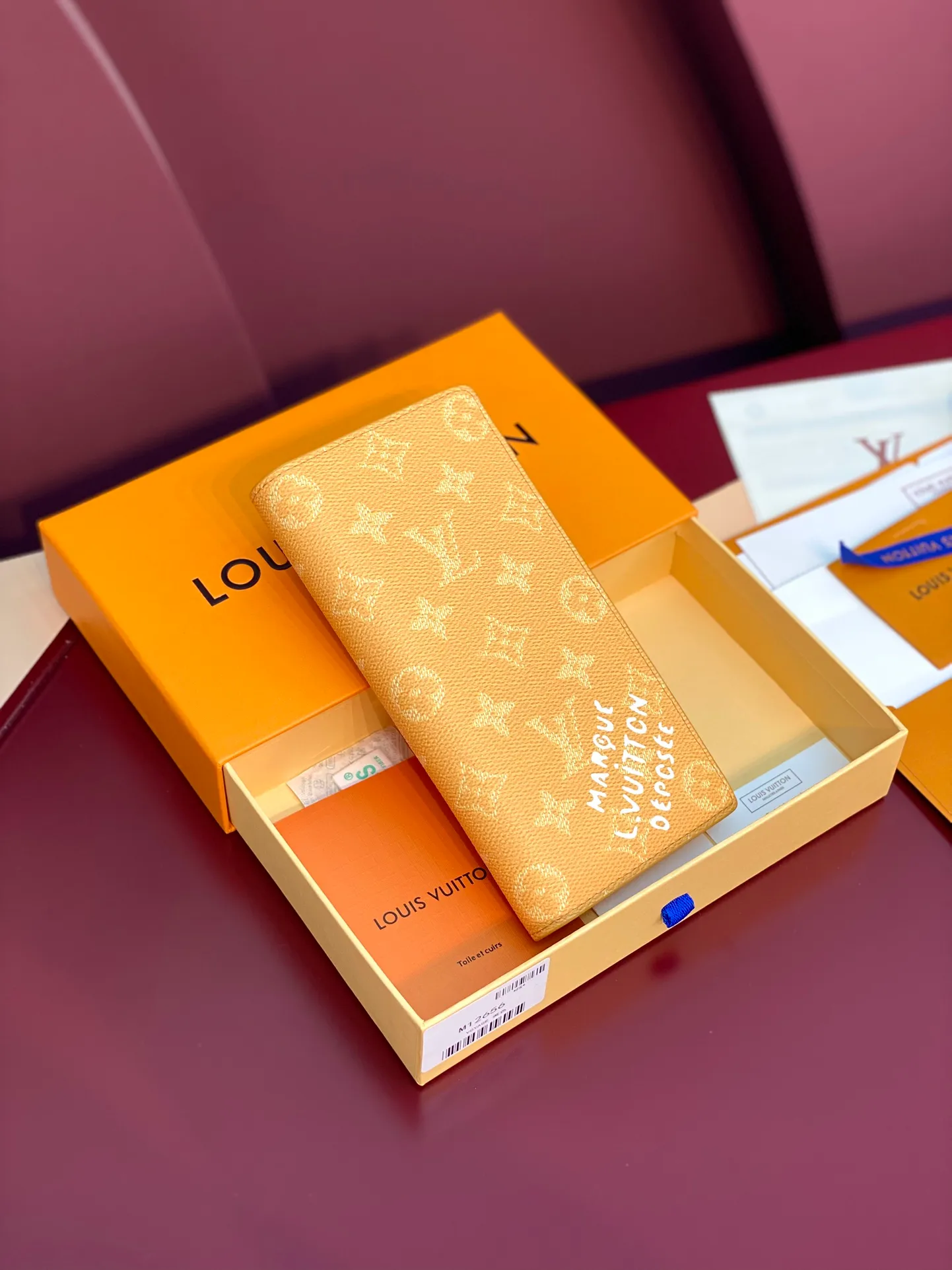 M12656 Yellow! BRAZZA Wallet, this Brazza Wallet is made of Monogram Heritage canvas, witnessing Pharrell Williams' new interpretation of the iconic Monogram pattern. Criss-crossing textures and the Marque L.Vuitton Déposée logo reflect classic elements of the original Damier print, while multiple card slots and compartments complete the long design without sacrificing functional details.  19 x 2 x 10 cm (height x width x length). 💰380
