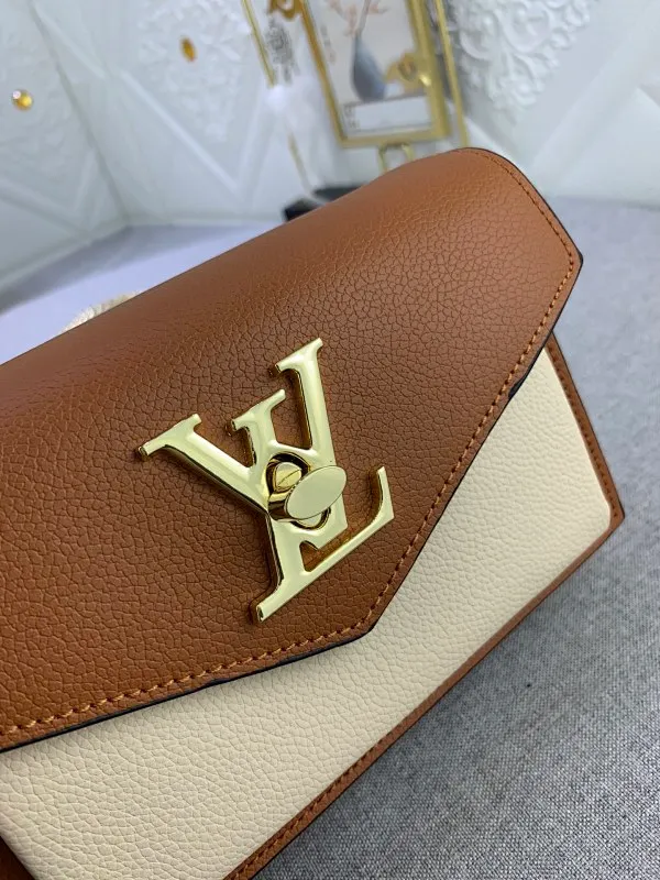 All Categories Official Website "Brand Women's Bags" Women's Bags 💙 LV This Mylockme Pochette chain bag is made of soft cow leather and continues the core elements of the Lockme series with an envelope-style flap, front pocket and LV letter hook. The trendy construction is suitable for storing mobile phones and other essentials, and the long chain allows for shoulder or cross-body wear. Detailed