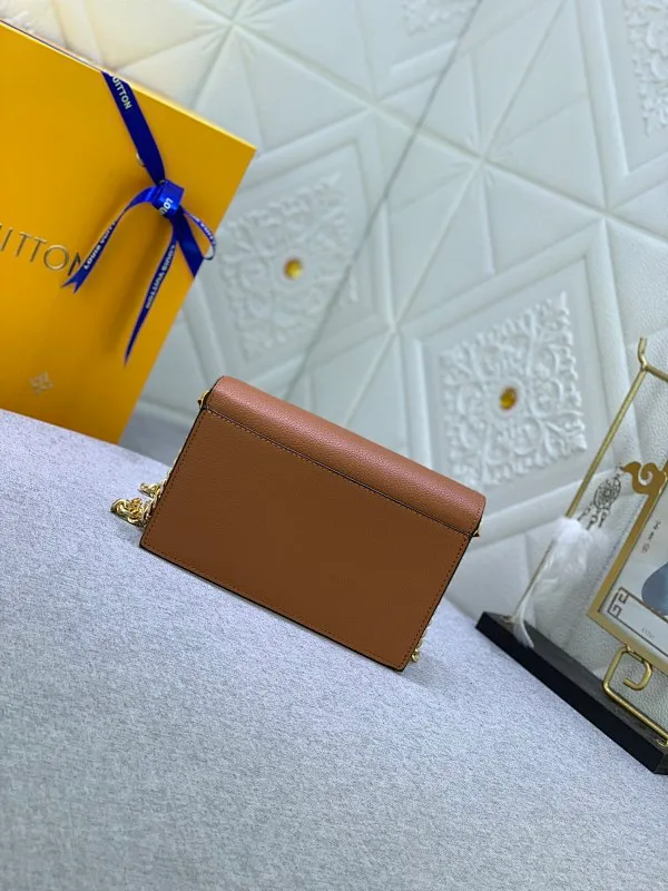 All Categories Official Website "Brand Women's Bags" Women's Bags 💙 LV This Mylockme Pochette chain bag is made of soft cow leather and continues the core elements of the Lockme series with an envelope-style flap, front pocket and LV letter hook. The trendy construction is suitable for storing mobile phones and other essentials, and the long chain allows for shoulder or cross-body wear. Detailed
