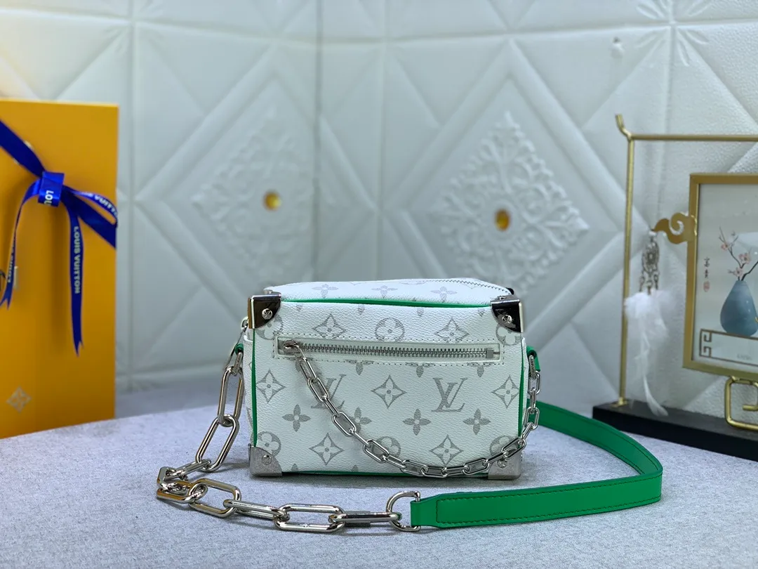 All Categories Official Website "Brand Women's Bags" Women's Bags 💙 LV has the new "Louis Vuitton!" signature printed on its vintage Monogram canvas and chunky chain, a mini soft trunk bag that is part of Virgil Abra's everyday LV capsule of the Men's Fall/Winter 2021-22 collection. Boxy shape and eight pieces of hardware to reinforce the corners. Can