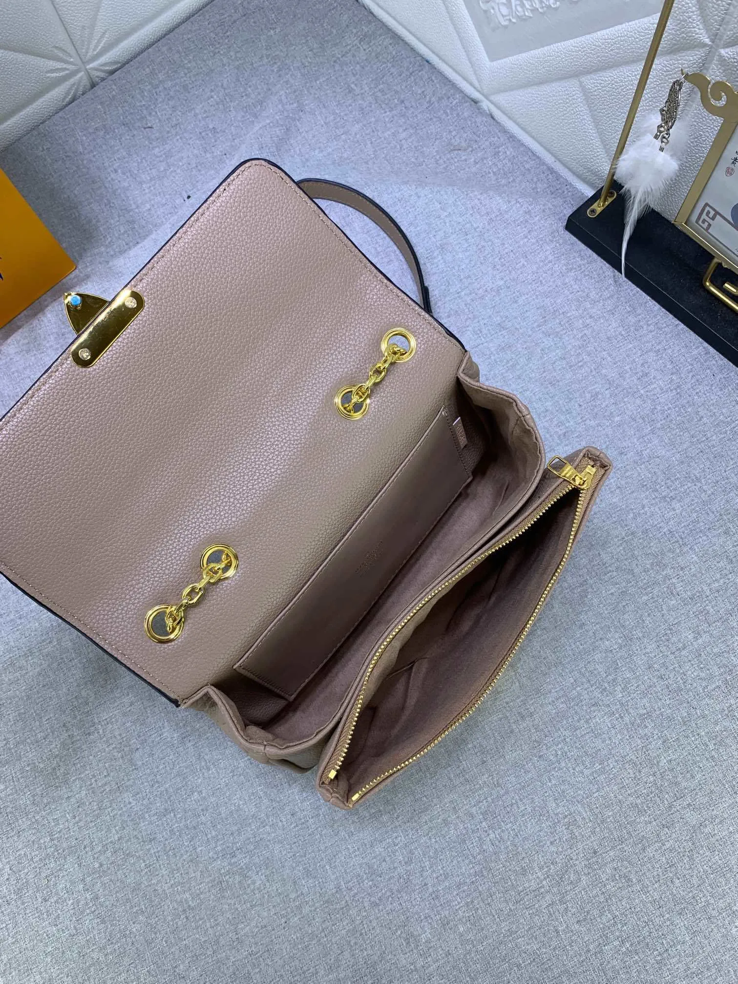 All Categories Official Website "Brand Women's Bags" Women's Bags 💙 LV Upgraded Original This Marceau chain bag is made of Monogram Empreinte embossed leather, with a plain leather flap and soft leather lining. Signature S-lock clasp and chain add to the elegance, and there's room for a large wallet and iPhone