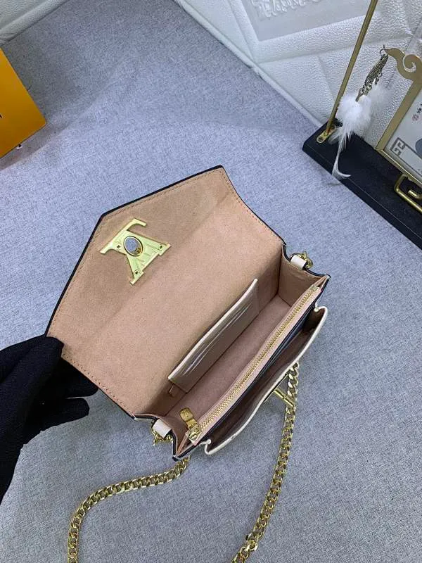 All Categories Official Website "Brand Women's Bags" Women's Bags 💙 LV This Mylockme Pochette chain bag is made of soft cow leather and continues the core elements of the Lockme series with an envelope-style flap, front pocket and LV letter hook. The trendy construction is suitable for storing mobile phones and other essentials, and the long chain allows for shoulder or cross-body wear. Detailed