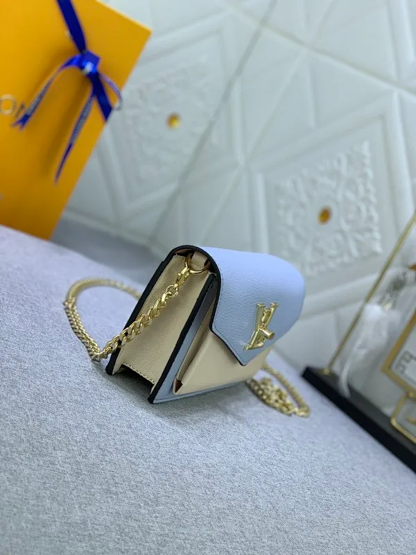 All Categories Official Website "Brand Women's Bags" Women's Bags 💙 LV This Mylockme Pochette chain bag is made of soft cow leather and continues the core elements of the Lockme series with an envelope-style flap, front pocket and LV letter hook. The trendy construction is suitable for storing mobile phones and other essentials, and the long chain allows for shoulder or cross-body wear. Detailed