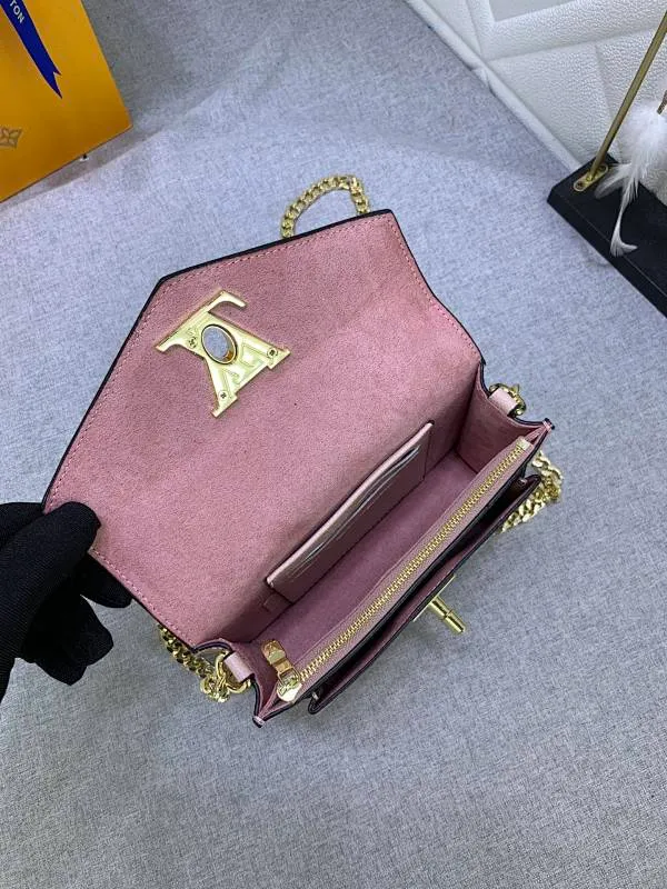 All Categories Official Website "Brand Women's Bags" Women's Bags 💙 LV This Mylockme Pochette chain bag is made of soft cow leather and continues the core elements of the Lockme series with an envelope-style flap, front pocket and LV letter hook. The trendy construction is suitable for storing mobile phones and other essentials, and the long chain allows for shoulder or cross-body wear. Detailed