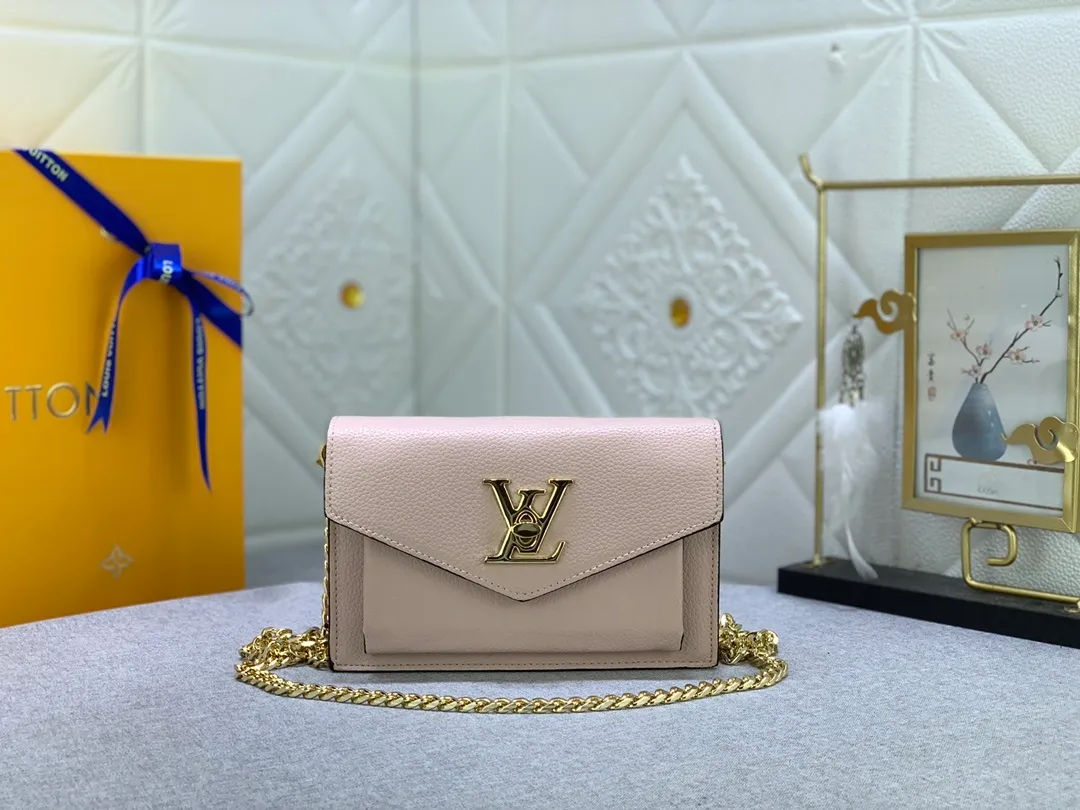 All Categories Official Website "Brand Women's Bags" Women's Bags 💙 LV This Mylockme Pochette chain bag is made of soft cow leather and continues the core elements of the Lockme series with an envelope-style flap, front pocket and LV letter hook. The trendy construction is suitable for storing mobile phones and other essentials, and the long chain allows for shoulder or cross-body wear. Detailed