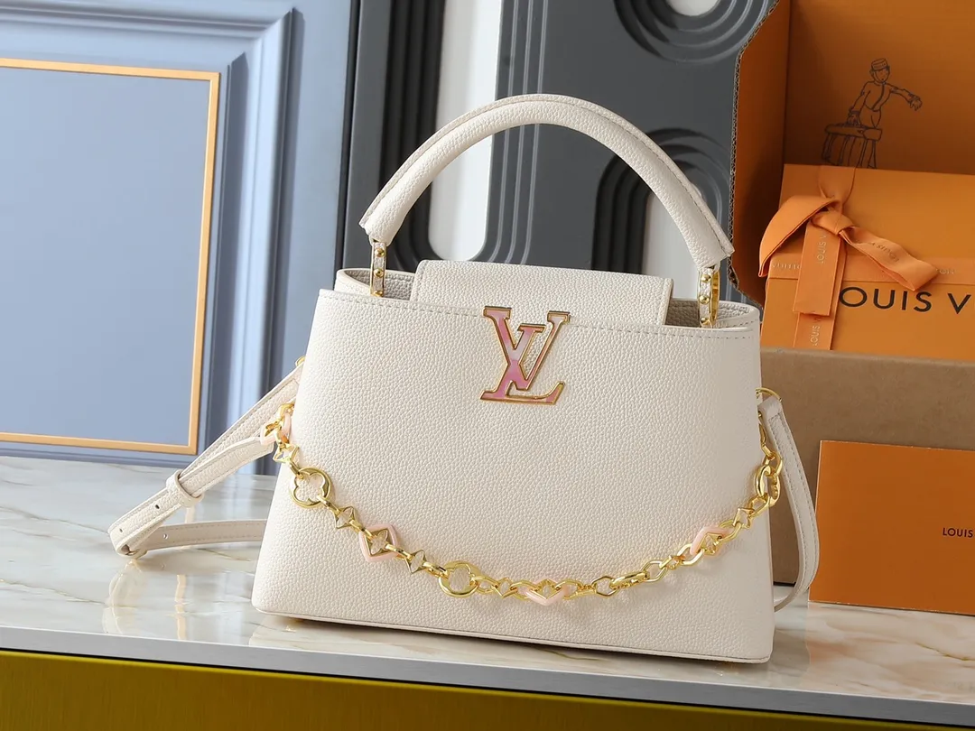 💰460💰Guangzhou goods Upgraded from the original M14381 M14970 M14393 M14972 M14971 This medium Capucines handbag comes from the Harmony series and explores the inspiration of the Monogram flower with a decorative chain. Taurillon cow leather creates an elegant structure, colorful resin outlines the LV letters, and the flip cover provides two styles: external or internal. The neat interior is equipped with multiple pockets, and the detachable and adjustable shoulder strap makes it easy to wear cross-body. Dimensions: 31.5 x 20.0 x 11.0 cm (length x height x width)