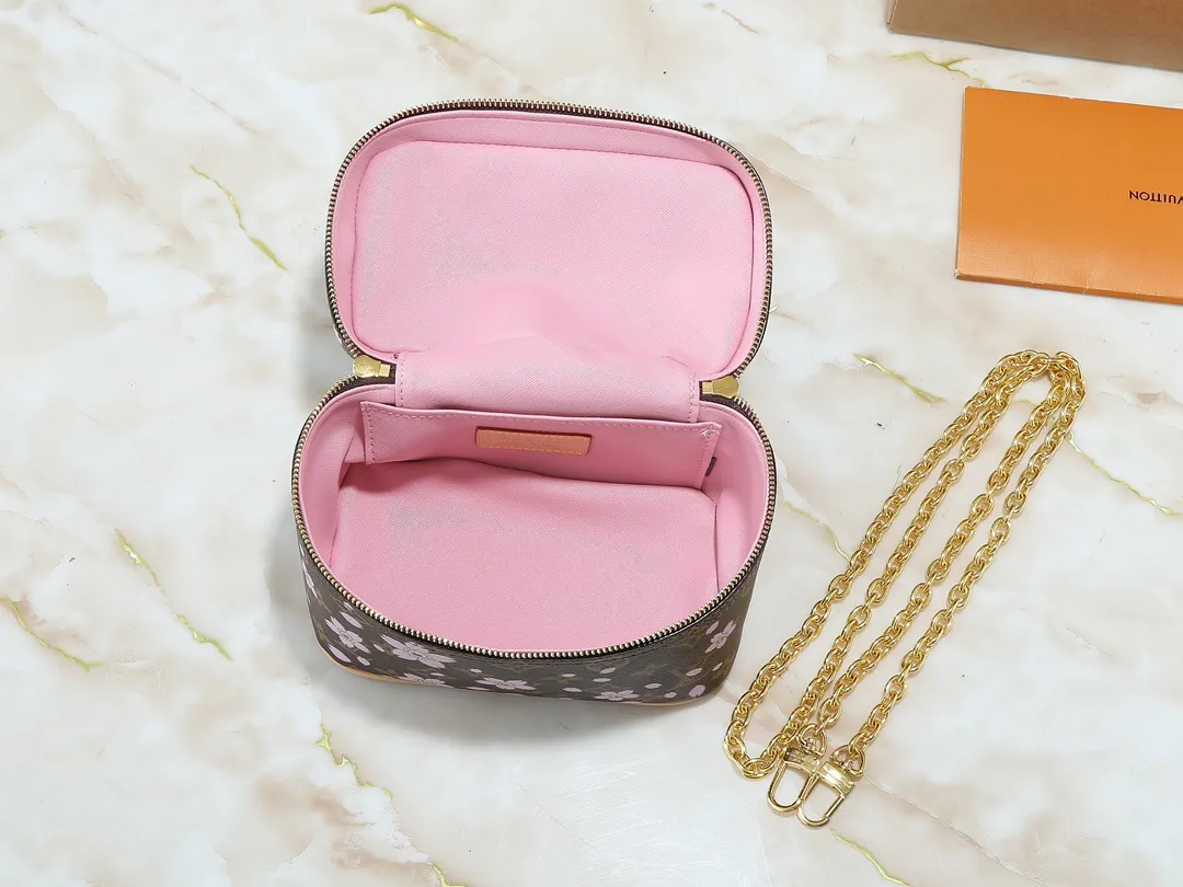 💰240💰Upgraded from the original M14181 M44495. This Nice mini cosmetic bag is made of Monogram coated canvas. The box-shaped outline is condensed with rounded strokes. The Cherry Blossom pattern releases the joyful atmosphere of the Louis Vuitton