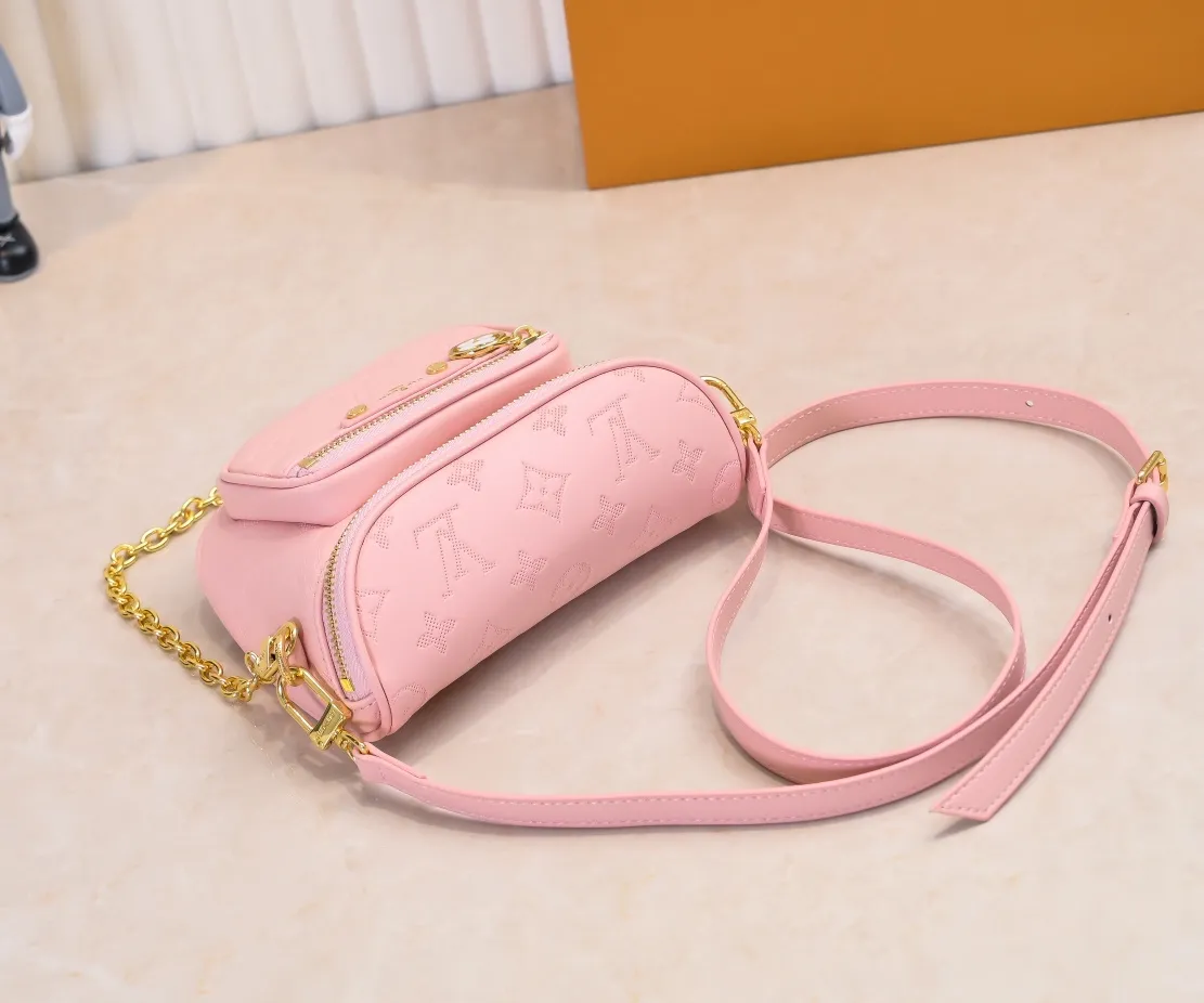 Batch 240💰Upgraded original M46917 M82335 M83275 M82208 M82347 This Mini Bumbag handbag comes from the LV Gradient series, and the Monogram embossing of Monogram Empreinte leather renders gradient midsummer colors. The on-trend construction features a zipped main compartment and a front pocket with a Louis Vuitton leather label. With the detachable chain and detachable and adjustable shoulder strap, it can be worn as a shoulder or cross-body bag. 17.0 x 12.0 x 9.5 cm (L x H x W) • Monogram Empreinte embossed soft-grained cowhide leather • Textile lining • Metal hardware • Zip closure • Zip front pocket • Shoulder strap: removable, adjustable • Half-length strap: 32.0 cm • Half-length strap adjustable to: 44.0 cm • Chain: Removable • Half-length chain: 20.0 cm