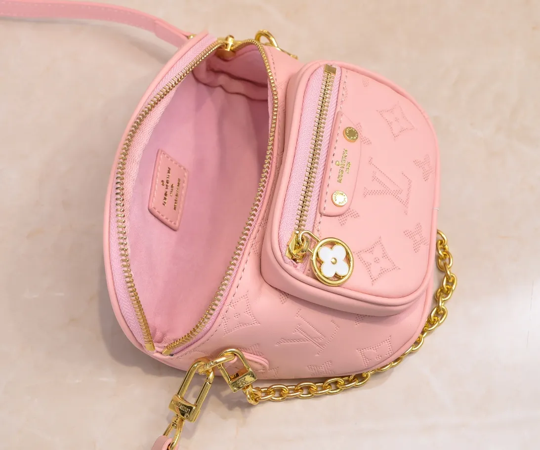 Batch 240💰Upgraded original M46917 M82335 M83275 M82208 M82347 This Mini Bumbag handbag comes from the LV Gradient series, and the Monogram embossing of Monogram Empreinte leather renders gradient midsummer colors. The on-trend construction features a zipped main compartment and a front pocket with a Louis Vuitton leather label. With the detachable chain and detachable and adjustable shoulder strap, it can be worn as a shoulder or cross-body bag. 17.0 x 12.0 x 9.5 cm (L x H x W) • Monogram Empreinte embossed soft-grained cowhide leather • Textile lining • Metal hardware • Zip closure • Zip front pocket • Shoulder strap: removable, adjustable • Half-length strap: 32.0 cm • Half-length strap adjustable to: 44.0 cm • Chain: Removable • Half-length chain: 20.0 cm