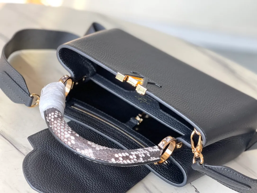 💰2460 (Special Grade Original Leather) N99387/M48865 Black Snake Shoulder This Capucines BB handbag is made of full-grain Taurillon leather and has a sophisticated structure. It has a top handle, a two-way flap and a logo outlined in python snakeskin, making it a gorgeous choice for both day and night. The detachable wide shoulder strap can be carried on the shoulder or cross-body for a edgy look. Size: 27 *18*9cm