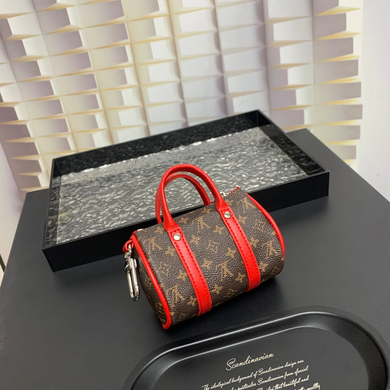 💰200 shipped😍 MINI KEEPALL bag charm and keychain ☀️Louis Vuitton Louis Vuitton lv mini pillow bag pendant ☀️This Mini Keepall bag charm and keychain condenses the classic handbag configuration, boldly showing the spirit of adventure. Monogram canvas with LV inscribed hook buckle, whether hung on a belt or handbag, its zipper closure and built-in keychain ensure secure storage
