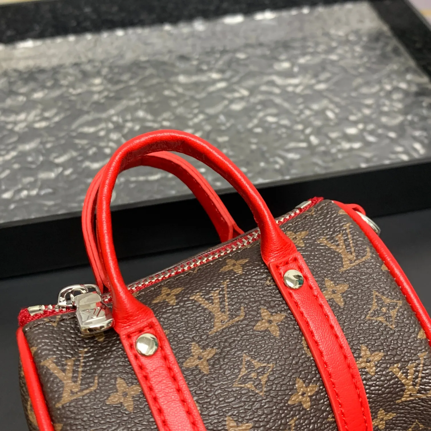 💰200 shipped😍 MINI KEEPALL bag charm and keychain ☀️Louis Vuitton Louis Vuitton lv mini pillow bag pendant ☀️This Mini Keepall bag charm and keychain condenses the classic handbag configuration, boldly showing the spirit of adventure. Monogram canvas with LV inscribed hook buckle, whether hung on a belt or handbag, its zipper closure and built-in keychain ensure secure storage