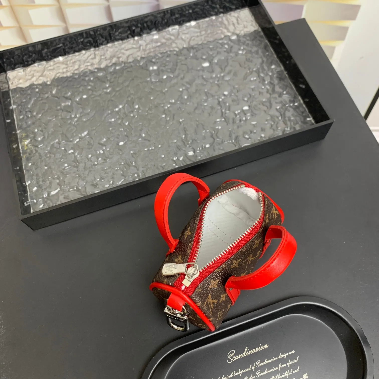 💰200 shipped😍 MINI KEEPALL bag charm and keychain ☀️Louis Vuitton Louis Vuitton lv mini pillow bag pendant ☀️This Mini Keepall bag charm and keychain condenses the classic handbag configuration, boldly showing the spirit of adventure. Monogram canvas with LV inscribed hook buckle, whether hung on a belt or handbag, its zipper closure and built-in keychain ensure secure storage