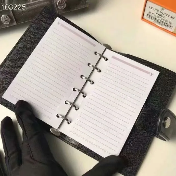 P140 Hot item shipped, model number M20005. This small notepad cover is made of Monogram canvas. It can hold three credit cards and can also be used as an address book, notebook or calendar. 10/12 cm (Length x Height) - Epi leather embossed with delicate LV initials and lined with interwoven textured leather - Button closure - Six-ring binder with three rings in sets, six credit card slots and two internal compartments - Notepad insert available separately