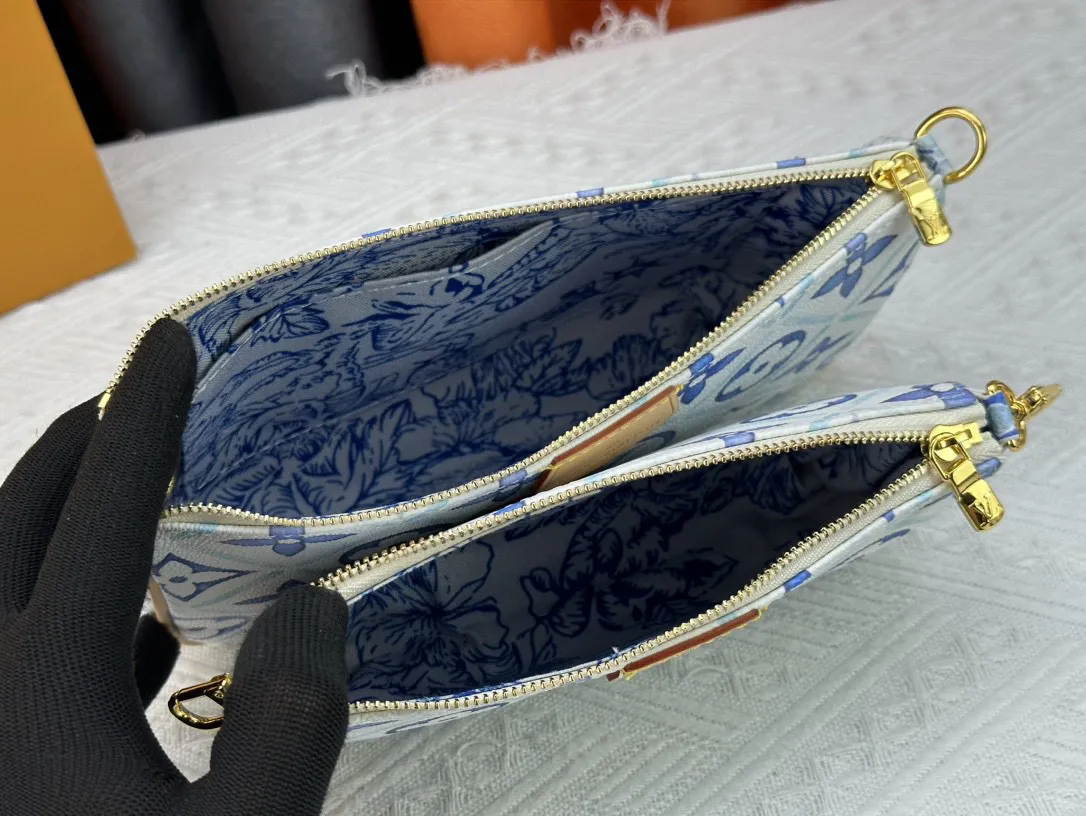 P260 Upgraded version M44823 M25374 Blue Five-in-one Mahjong bag series The new season MULTI POCHETTE ACCESSOIRES Xph handbag This Multi Pochette Accessoires handbag comes from the LV By The Pool series, using Monogram Tiles canvas to release the summer atmosphere, and then the zipper bags are nestled together. Explore more styling and carrying possibilities with the detachable and adjustable wide fabric shoulder strap and dazzling chain. Dimensions: 24 x 13.5x4 cm