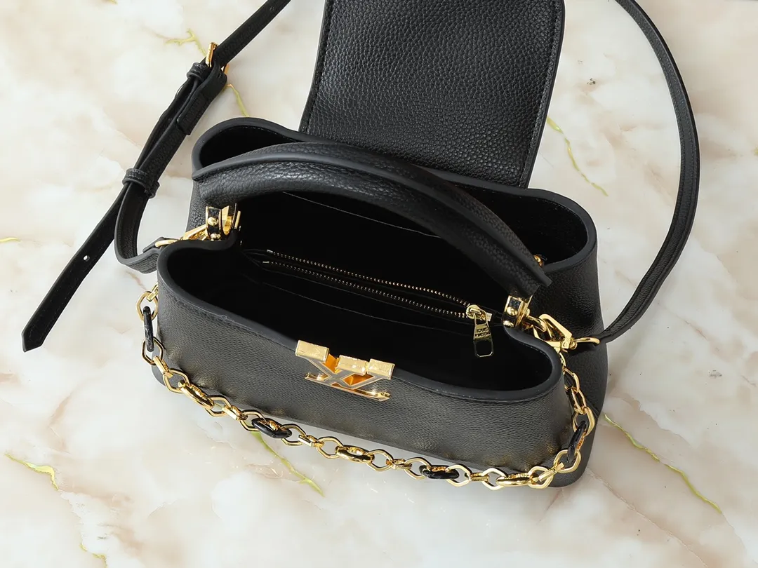 💰440💰Guangzhou goods Upgraded from the original M14381 M14970 M14393 M14972 M14971 This Capucines BB handbag quotes the design elements of the Harmony series and tells the inspiration of the Monogram flower with a gorgeous chain. The Taurillon cow leather body is embellished with a resin-coated LV logo, and the flap can be opened externally or internally to reveal a neat interior with multiple pockets. Dimensions: 27.0 x 17.3 x 9.0 cm (length x height x width)