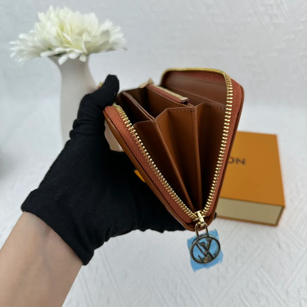 P130 M81511 Earthy Yellow Sewn with padded Monogram embossed lambskin, it complements the Coussin leather boutique series. Beautifully designed with a gold-tone zipper embossed with the LV Circle signature pull, the interior of the all-in-one wallet is packed with practical features, including three large compartments, a coin compartment and 12 business card slots. Dimensions: 19.5 x 10.5 x 2.5 cm