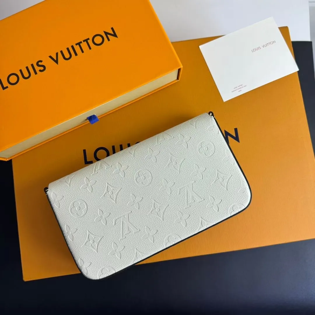 P150💰💖This Pochette Félicie three-in-one💖 chain bag is made of Monogram Empreinte leather, with subtle embossing to present Louis Vuitton’s classic Monogram pattern. The envelope-style construction offers ample interior space, and includes a removable zippered pocket and card compartment. Attach the chain to explore more modern carrying options. Model: M64065 white / 61276 Dimensions: 21 x 12 x 3 cm (length x height x width)
