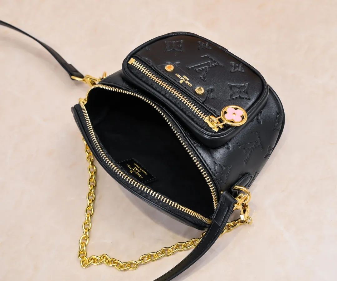 Batch 240💰Upgraded original M46917 M82335 M83275 M82208 M82347 This Mini Bumbag handbag comes from the LV Gradient series, and the Monogram embossing of Monogram Empreinte leather renders gradient midsummer colors. The on-trend construction features a zipped main compartment and a front pocket with a Louis Vuitton leather label. With the detachable chain and detachable and adjustable shoulder strap, it can be worn as a shoulder or cross-body bag. 17.0 x 12.0 x 9.5 cm (L x H x W) • Monogram Empreinte embossed soft-grained cowhide leather • Textile lining • Metal hardware • Zip closure • Zip front pocket • Shoulder strap: removable, adjustable • Half-length strap: 32.0 cm • Half-length strap adjustable to: 44.0 cm • Chain: Removable • Half-length chain: 20.0 cm