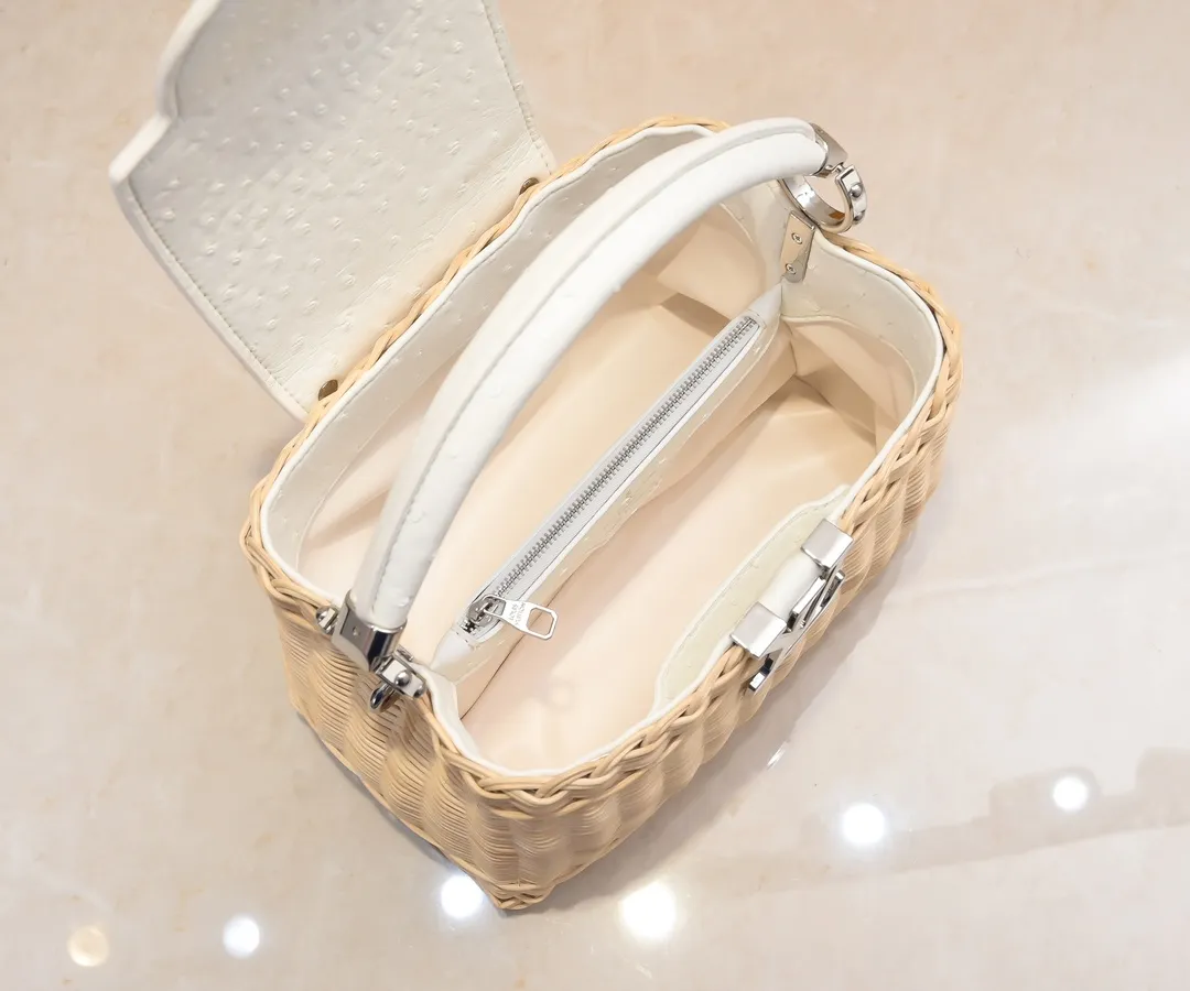 The upgraded version of P680 M11619 crocodile pattern CapucinesBB handbag has a unique rattan weaving structure, paying tribute to the Louis Vuitton picnic box design that came out in 1892. The cow leather shapes the top handle and flap, the LV letters reveal a metallic texture, and the detachable and adjustable leather shoulder strap makes it easy to carry on the shoulder. The gift box packaging provided with this product may be reasonably adjusted depending on the stock situation, and may be different from the packaging style displayed on this product page. Please refer to the actual gift box packaging style received for details. Size:27×17.3×9cm