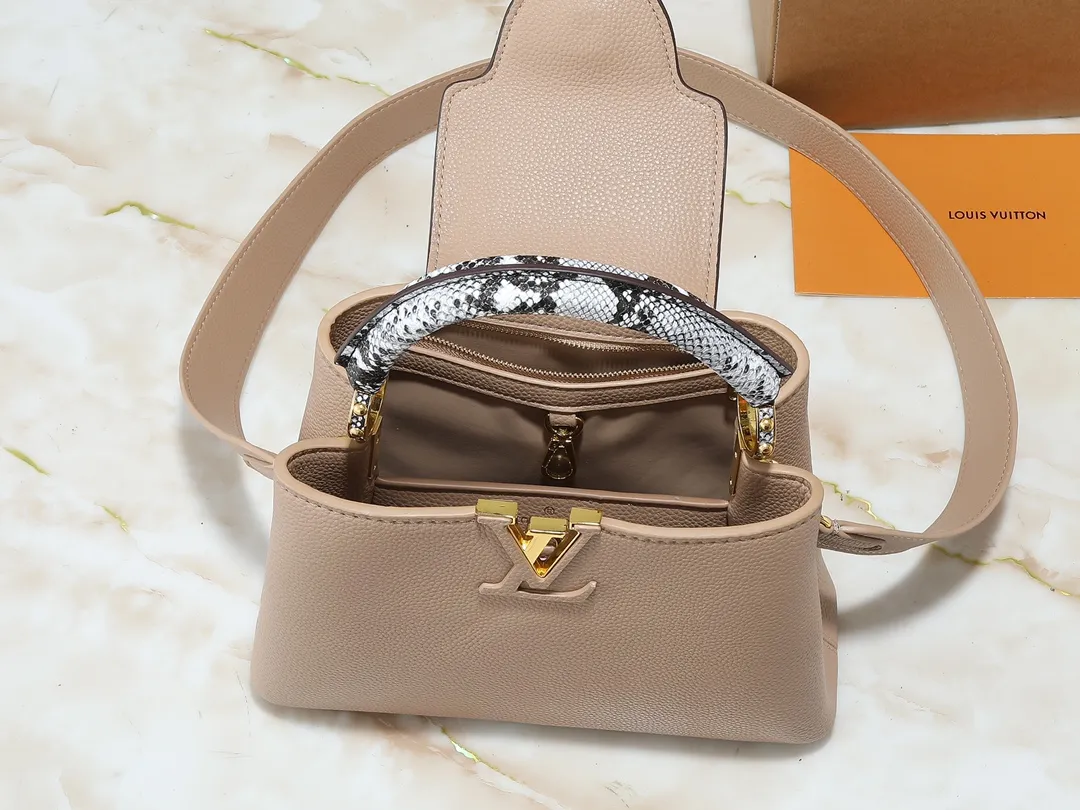 💰340💰Guangzhou goods Upgraded original M80071 M80041 M81410 M81258 M98477 This Capucines handbag displays the subtle sheen of the delicate Taurillon leather and python leather handles, embellished with iconic letters. The detachable wide shoulder strap allows the compact size to be worn on the shoulder or cross-body. Dimensions: 27.0 x 17.3 x 9.0 cm