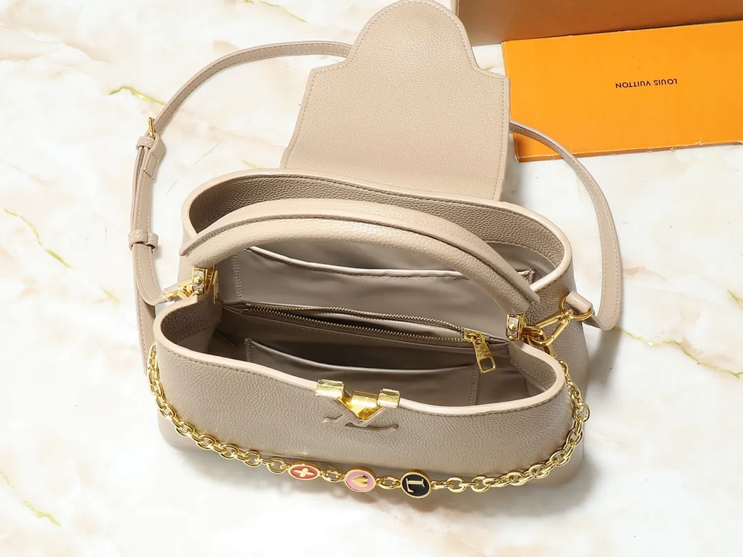 💰420💰Guangzhou goods Upgraded original M00014 M00013 M00015 [New size] This Capucines new size handbag shows soft beauty: Taurillon leather body with light-colored flap and top handle, enamel Monogram flower chain can also achieve a shoulder-carrying experience. Wear the slim leather strap to explore more styling possibilities. Dimensions 31.5 x 20 x 11 cm (length x height x width)