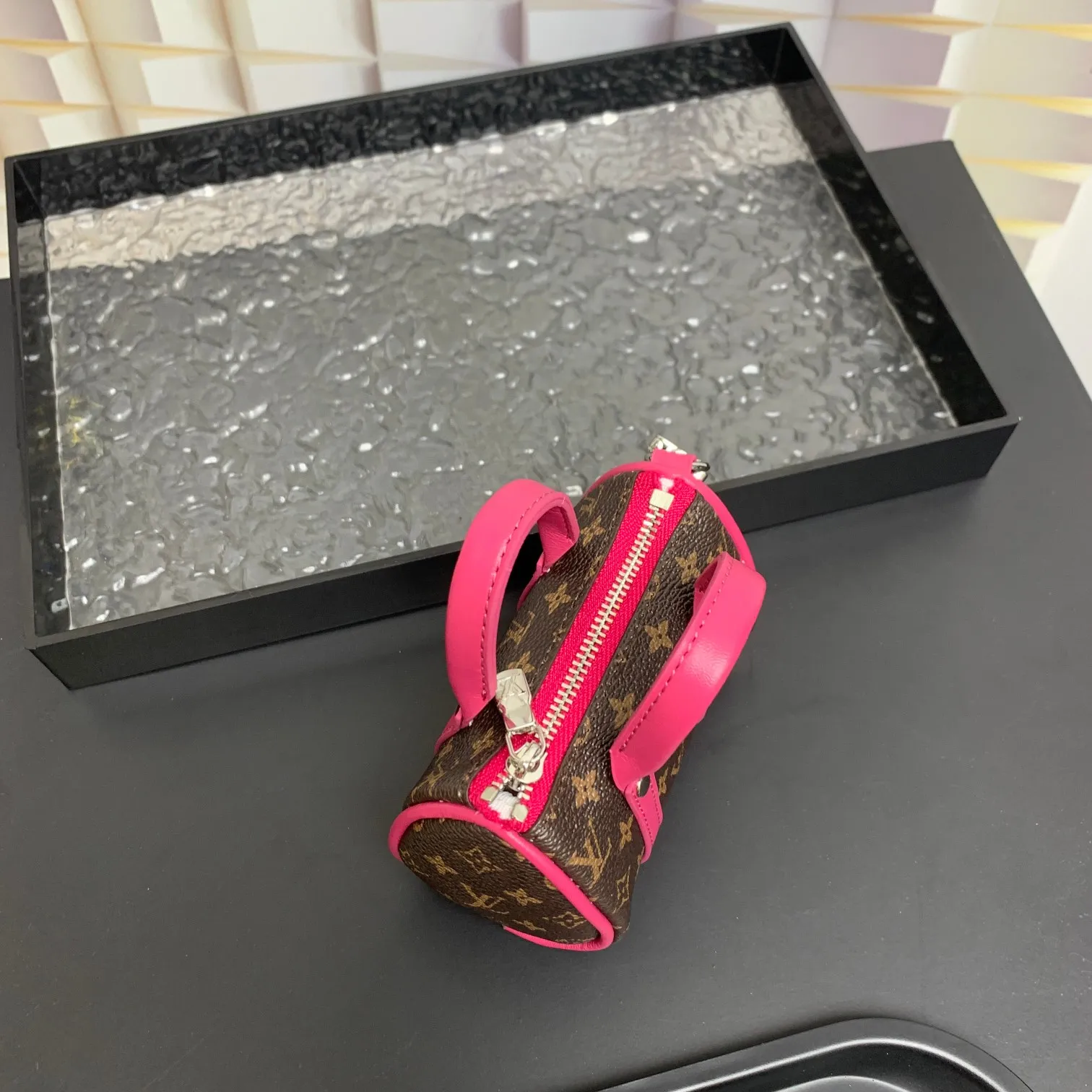 💰200 shipped😍 MINI KEEPALL bag charm and keychain ☀️Louis Vuitton Louis Vuitton lv mini pillow bag pendant ☀️This Mini Keepall bag charm and keychain condenses the classic handbag configuration, boldly showing the spirit of adventure. Monogram canvas with LV inscribed hook buckle, whether hung on a belt or handbag, its zipper closure and built-in keychain ensure secure storage