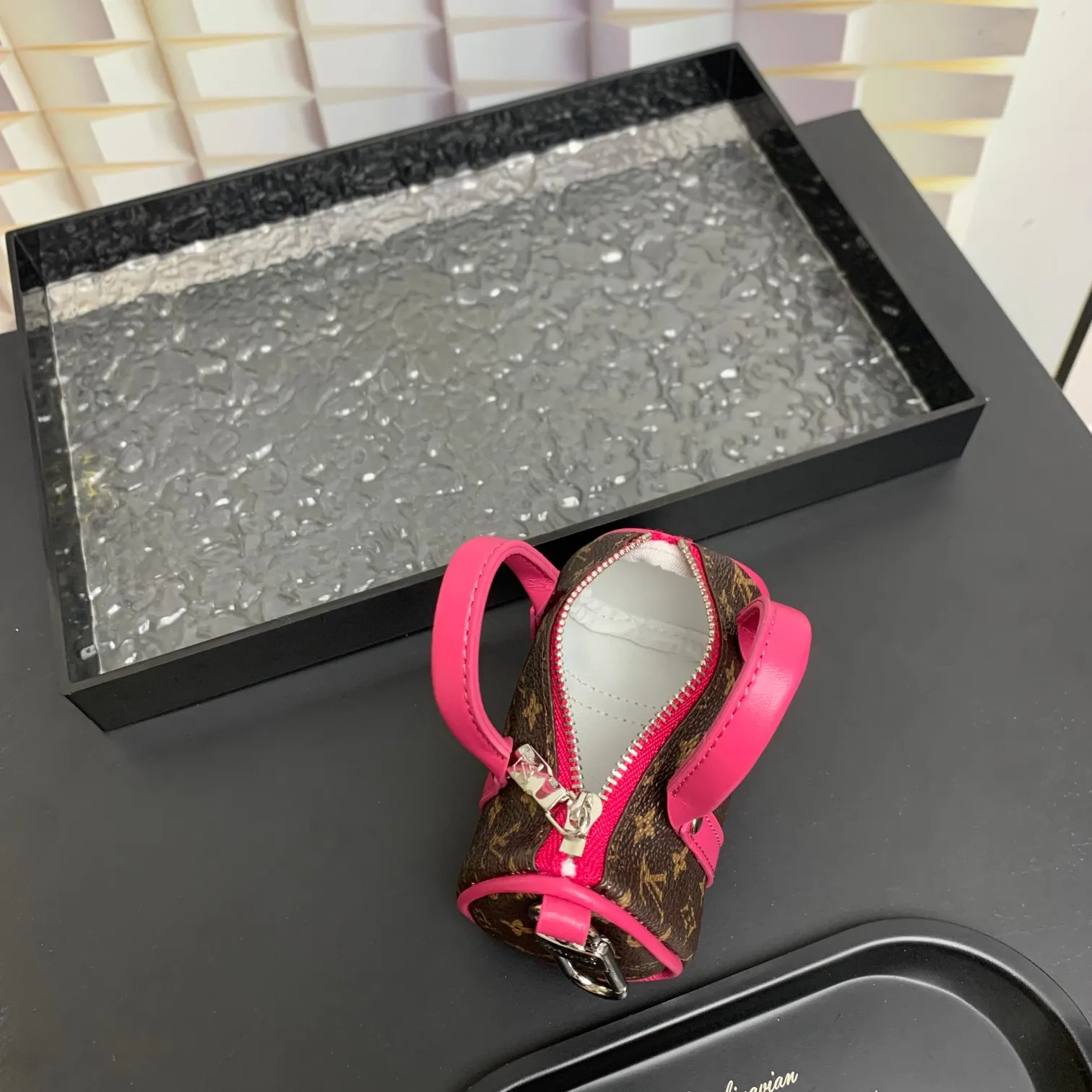 💰200 shipped😍 MINI KEEPALL bag charm and keychain ☀️Louis Vuitton Louis Vuitton lv mini pillow bag pendant ☀️This Mini Keepall bag charm and keychain condenses the classic handbag configuration, boldly showing the spirit of adventure. Monogram canvas with LV inscribed hook buckle, whether hung on a belt or handbag, its zipper closure and built-in keychain ensure secure storage