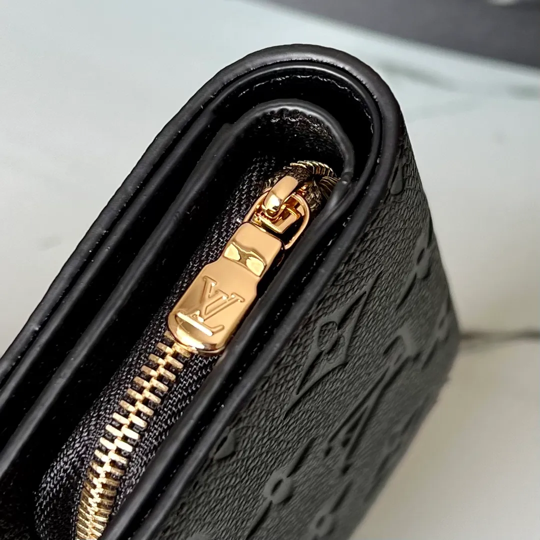 Factory price 480 Top original order M80152 Black This Cléa wallet is made of Monogram Empreinte soft grained cowhide, embellished with Louis Vuitton's iconic Monogram embossed pattern. It has a stylish design, is exquisite and compact but has a spacious capacity. It is equipped with an external patch pocket, zipper coin pocket, banknote compartment and six credit card slots. Details 12 x 9 x 3.5 cm (Length x Height x Width) Turtledove beige Soft grained embossed cowhide Leather lining Gold-tone hardware Snap-button closure Compartment for notes Accordion zip coin pocket External patch pocket Inner card compartment 6 credit card slots