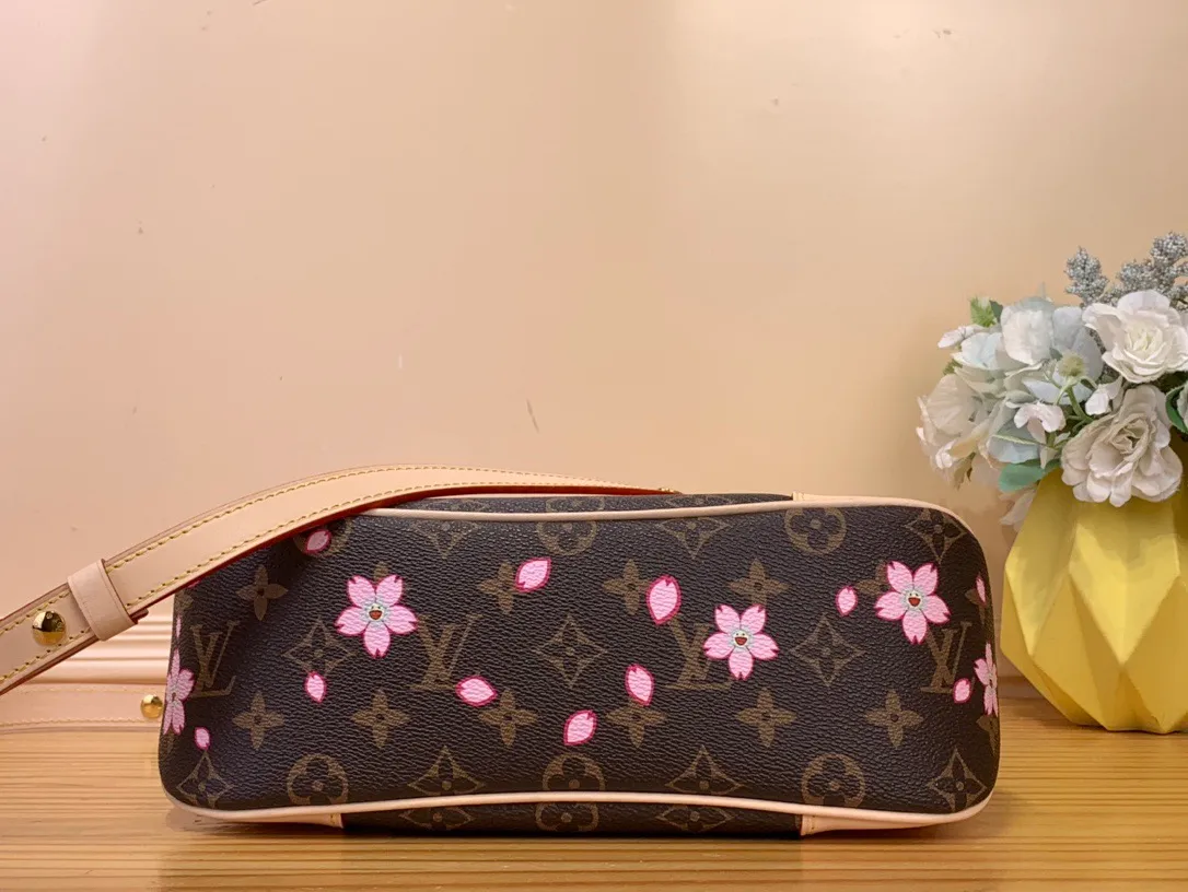 💰1120 (Steel Hardware) Top Original LV x TM BOULOGNE Handbag] M13265 Cherry Blossom This Boulogne handbag is from the Louis Vuitton x Murakami replica series, using Monogram coated canvas to highlight the vitality of the Cherry Blossom pattern. Classic leather shapes the detachable studded shoulder strap and corners, while dazzling metal hardware adds sophistication. Dimensions: 16 x 9.5 x 29 cm