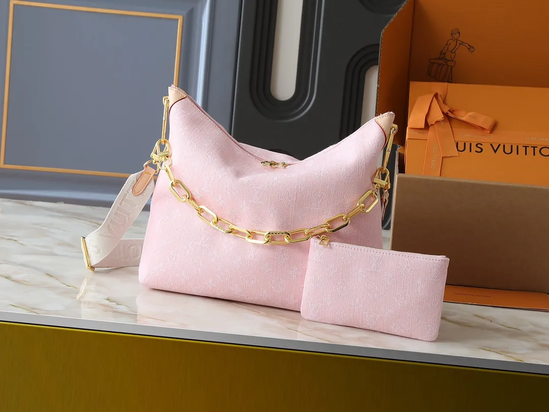 💰260💰Upgraded original M13390 M12072 M12068 M12071 This Coussin Hobo MM handbag celebrates the return of the brand’s iconic Monogram Denim pattern, originally launched in 2005. Made of organic cotton, it's woven from black and white yarns that have been faded to create a vintage look. Spacious, it's decorated with a light gold metallic finish and includes a removable pocket with a slide lock to securely store small items. This model can be worn crosswise, on the shoulder or on the hand. Dimensions: 38 x 33 x 10 cm (LxHxW)