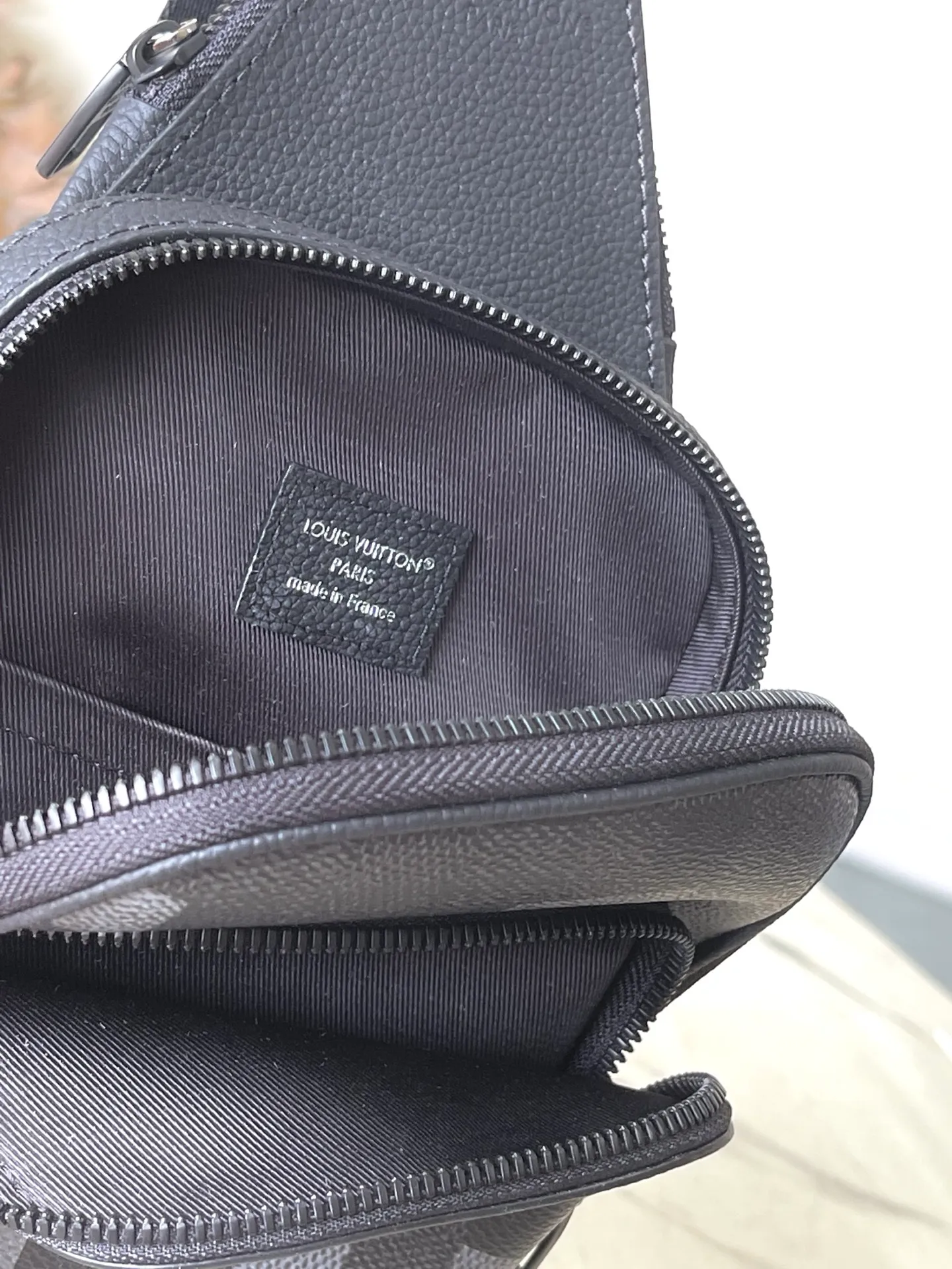 💰900 Top Original M14953 Damoflage black coated canvas adds a contemporary feel to the Avenue Slingbag's modern silhouette. A pixelated checkerboard pattern of grays and blacks is paired with matte black hardware for a masculine look. The Avenue features a main compartment and two zippered pockets for added functionality. The single shoulder strap is adjustable for comfortable cross-body wear. Appearance may vary slightly depending on pattern placement. Size: 16*5.7*33cm