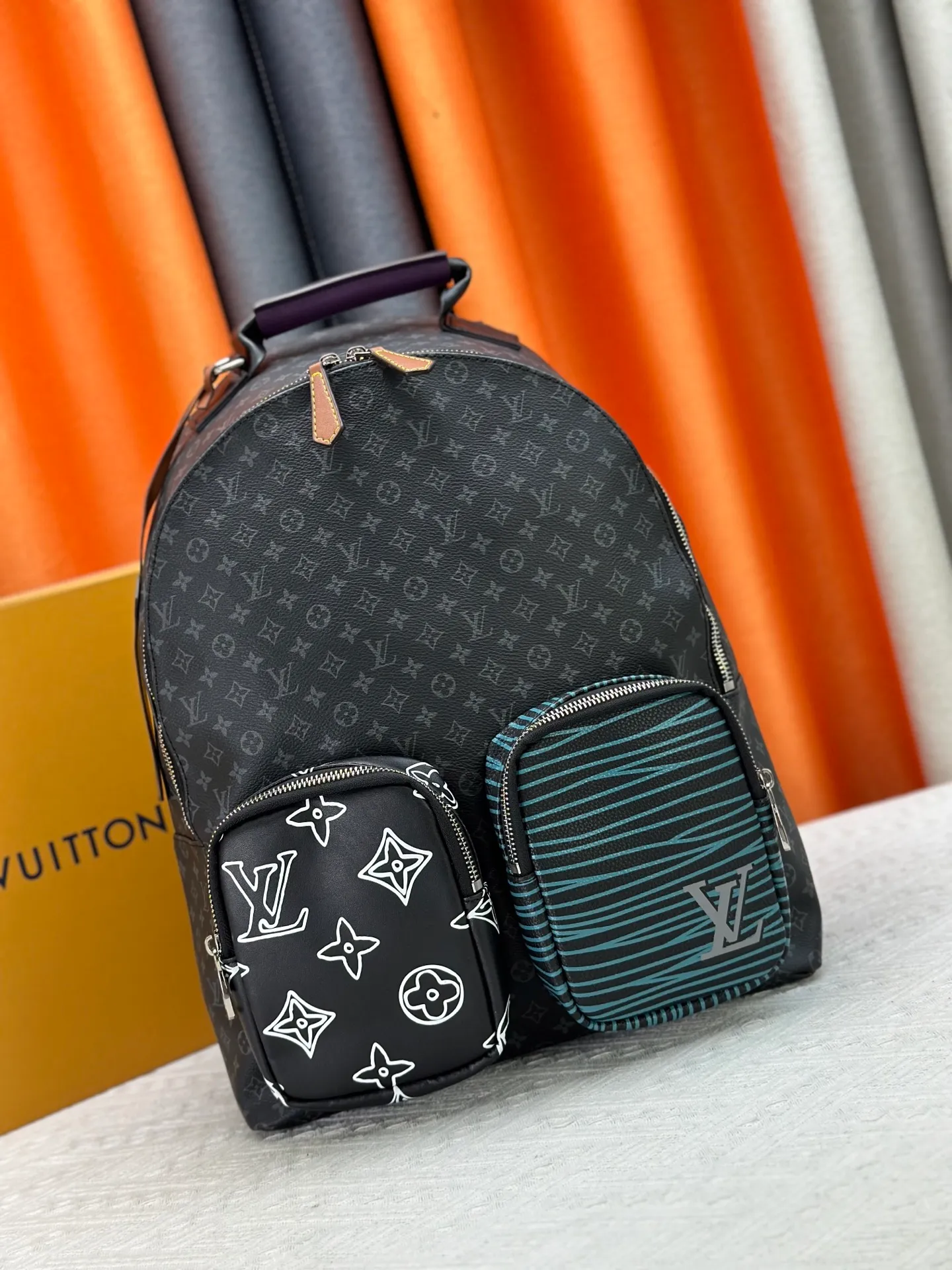 P360 M45455 Black Flower MULTIPOCKET Backpack Virgil Abloh incorporates the Patchwork theme of the 2020 Autumn and Winter series into this Multipocket backpack, creating a variety of styles from a trendy perspective. The zipped main compartment holds a laptop, and exterior pockets feature the classic Monogram and Epi graphics. Monogram Eclipse coated canvas and cowhide Leather and fabric trim Textile lining Hardware Louis Vuitton logo tag Top leather carry handle Zip main compartment with leather zip puller Zip front pocket Internal patch pocket Designer handle: Single handle Dimensions: 30.0 x 40.0 x 15.5 cm