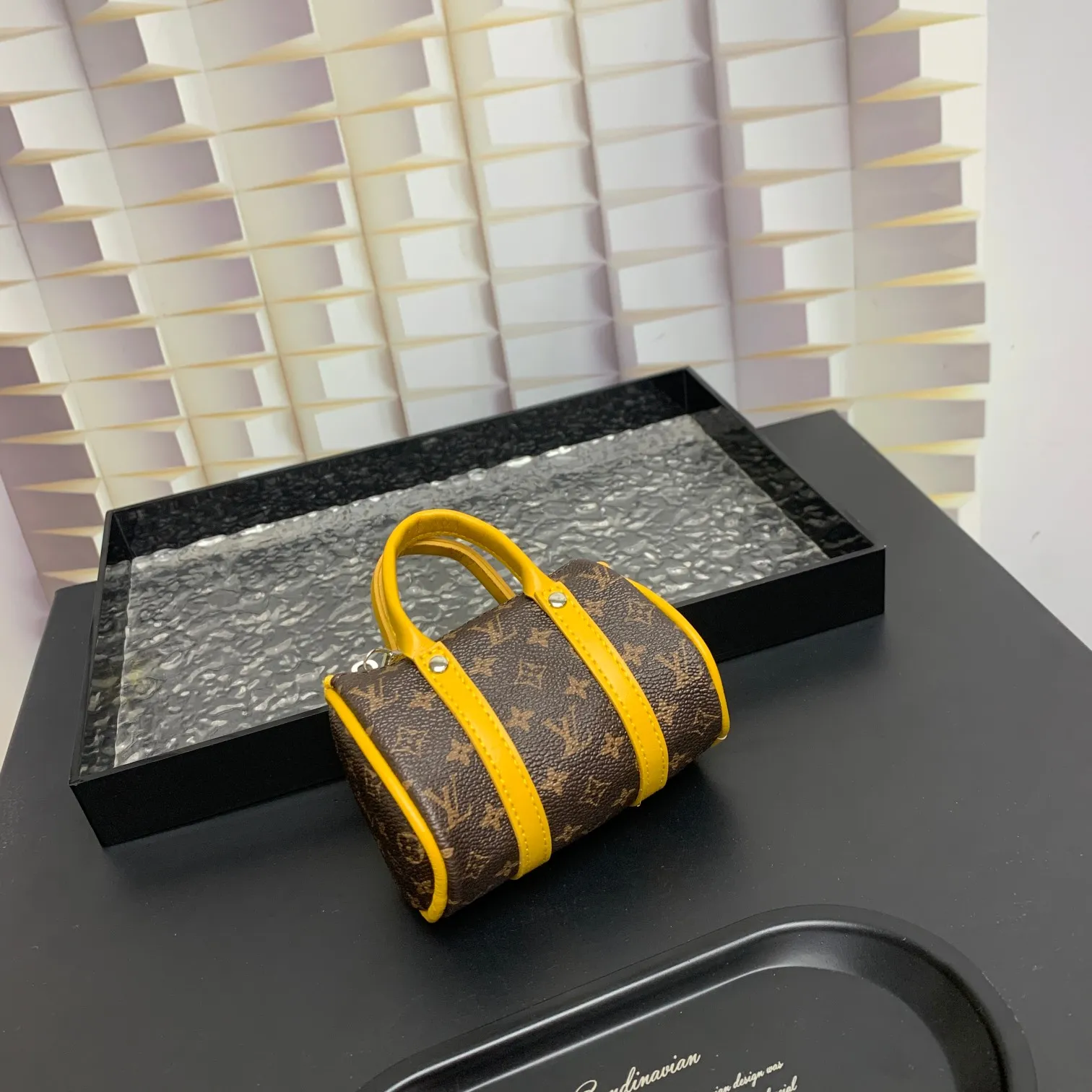 💰200 shipped😍 MINI KEEPALL bag charm and keychain ☀️Louis Vuitton Louis Vuitton lv mini pillow bag pendant ☀️This Mini Keepall bag charm and keychain condenses the classic handbag configuration, boldly showing the spirit of adventure. Monogram canvas with LV inscribed hook buckle, whether hung on a belt or handbag, its zipper closure and built-in keychain ensure secure storage