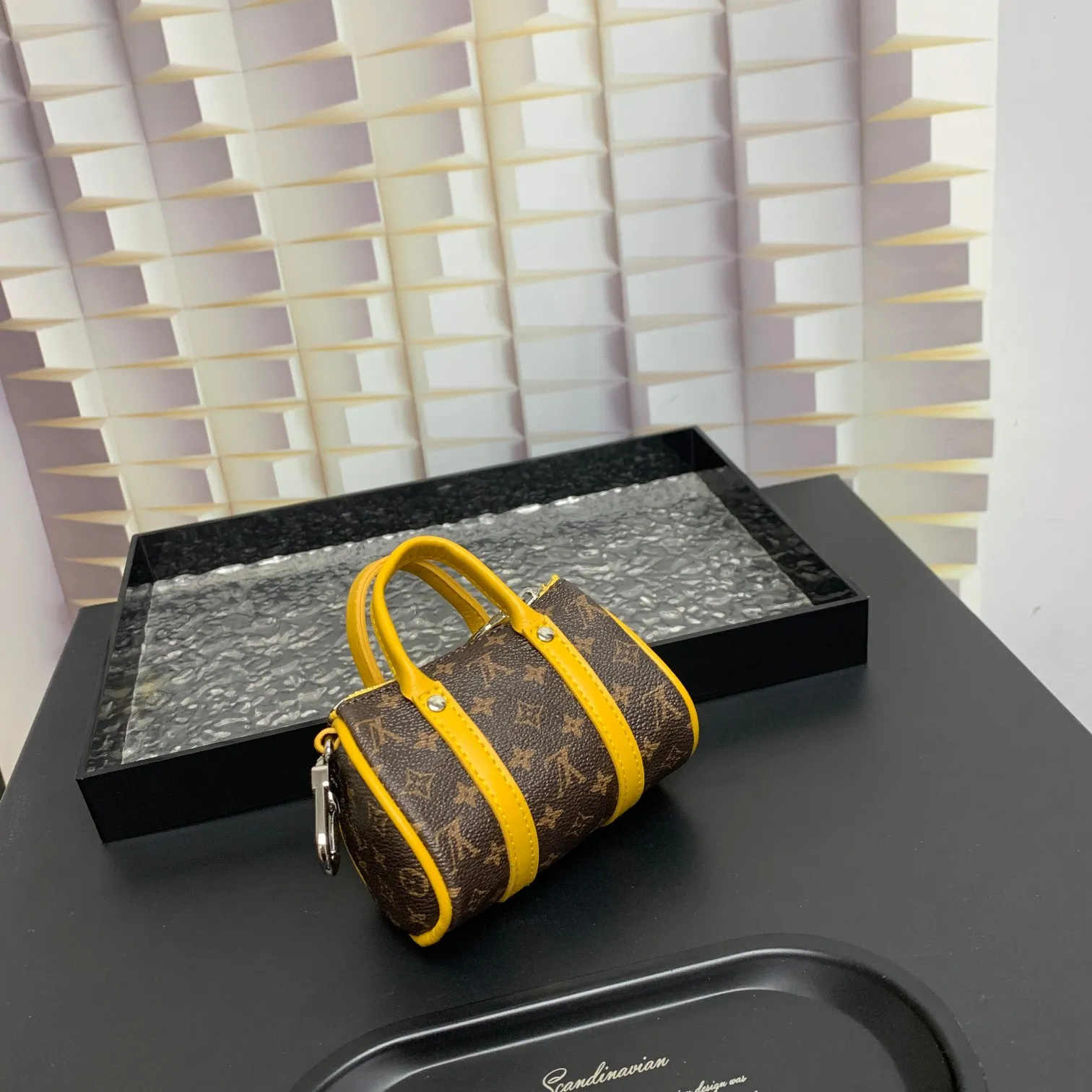 💰200 shipped😍 MINI KEEPALL bag charm and keychain ☀️Louis Vuitton Louis Vuitton lv mini pillow bag pendant ☀️This Mini Keepall bag charm and keychain condenses the classic handbag configuration, boldly showing the spirit of adventure. Monogram canvas with LV inscribed hook buckle, whether hung on a belt or handbag, its zipper closure and built-in keychain ensure secure storage