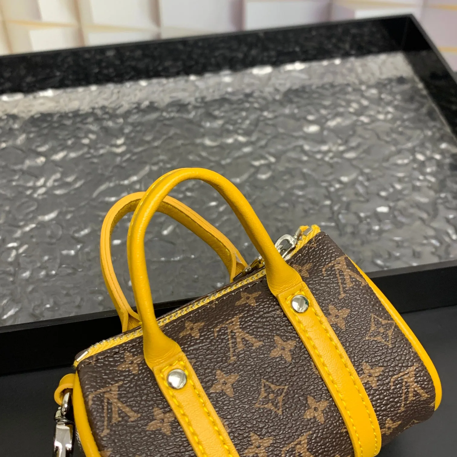 💰200 shipped😍 MINI KEEPALL bag charm and keychain ☀️Louis Vuitton Louis Vuitton lv mini pillow bag pendant ☀️This Mini Keepall bag charm and keychain condenses the classic handbag configuration, boldly showing the spirit of adventure. Monogram canvas with LV inscribed hook buckle, whether hung on a belt or handbag, its zipper closure and built-in keychain ensure secure storage