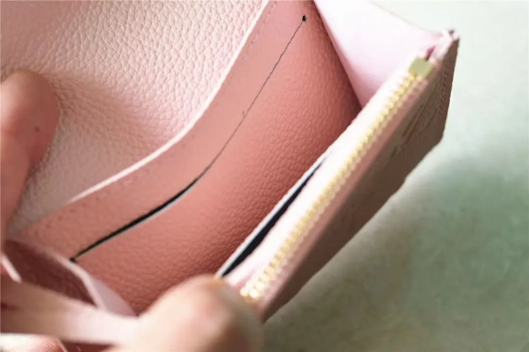 Factory price 280 [Top original order] M81455 pink first-layer cowhide👏👏This Rosalie coin purse is made of Monogram Empreinte embossed soft-grained cowhide. It opens with a round flip cover and has a compact configuration. It has a zippered coin pocket, a patch pocket and a card compartment inside. Louis Vuitton logo-engraved snaps secure the closure. Size: 11X8X2.5cm.