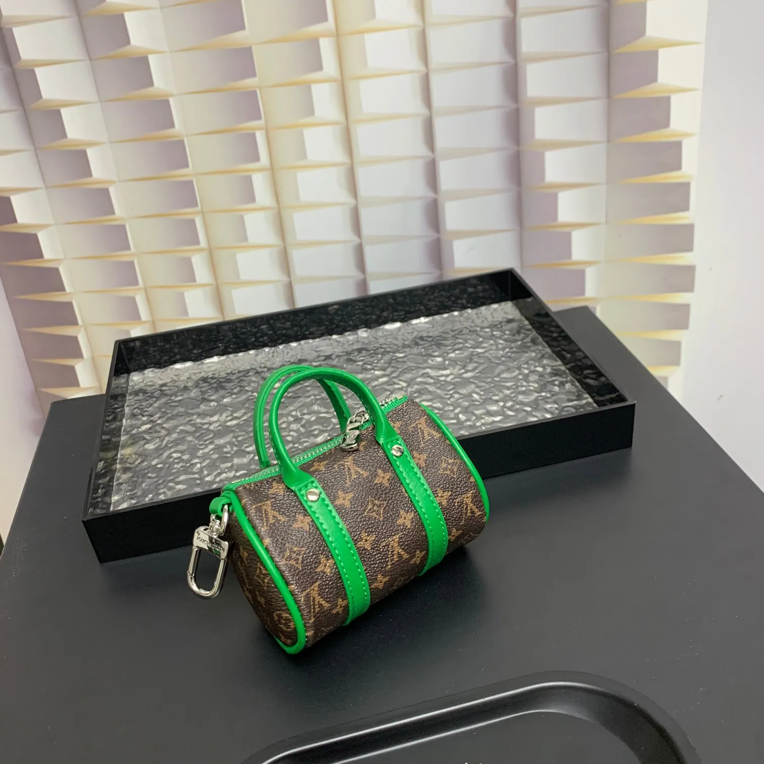 💰200 shipped😍 MINI KEEPALL bag charm and keychain ☀️Louis Vuitton Louis Vuitton lv mini pillow bag pendant ☀️This Mini Keepall bag charm and keychain condenses the classic handbag configuration, boldly showing the spirit of adventure. Monogram canvas with LV inscribed hook buckle, whether hung on a belt or handbag, its zipper closure and built-in keychain ensure secure storage