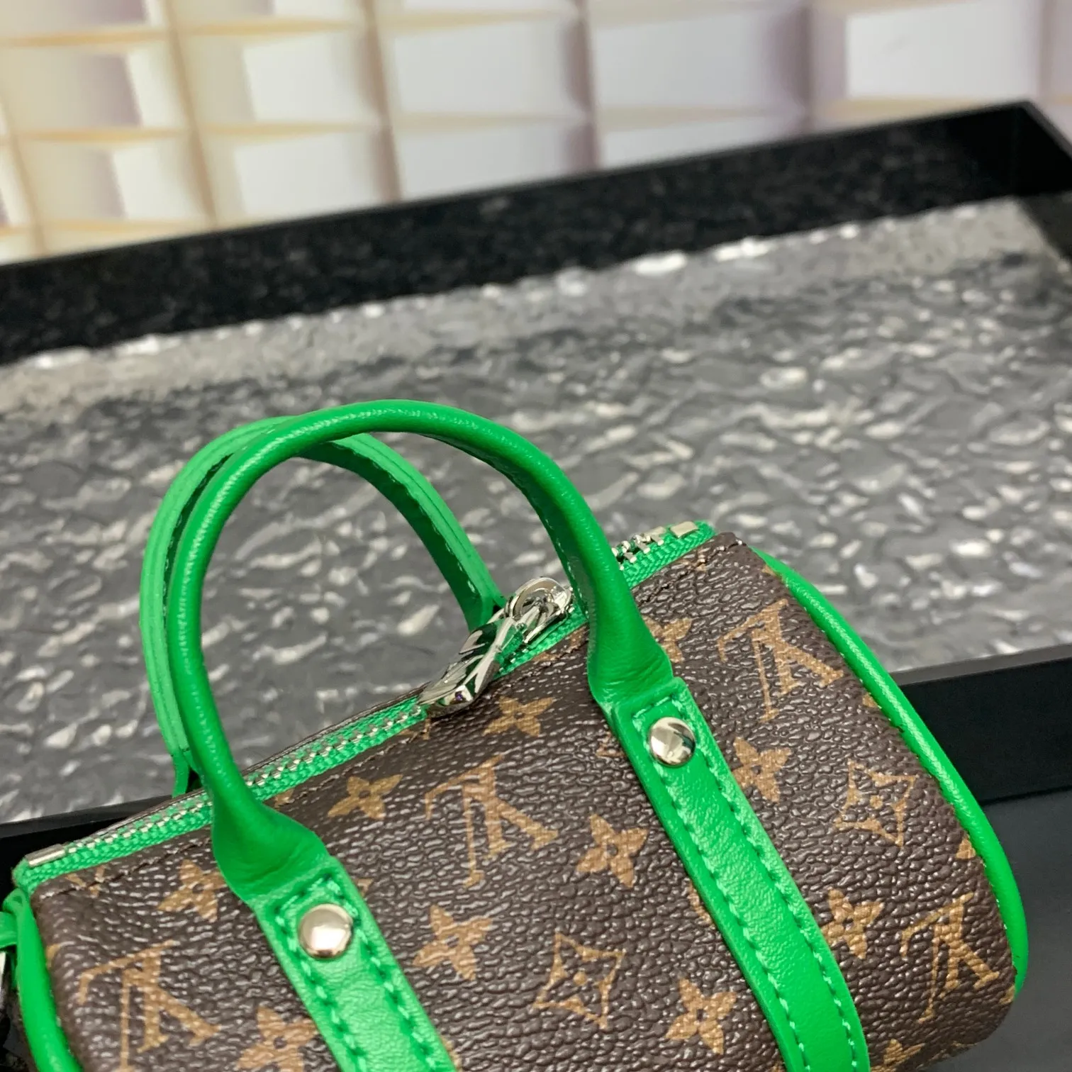 💰200 shipped😍 MINI KEEPALL bag charm and keychain ☀️Louis Vuitton Louis Vuitton lv mini pillow bag pendant ☀️This Mini Keepall bag charm and keychain condenses the classic handbag configuration, boldly showing the spirit of adventure. Monogram canvas with LV inscribed hook buckle, whether hung on a belt or handbag, its zipper closure and built-in keychain ensure secure storage