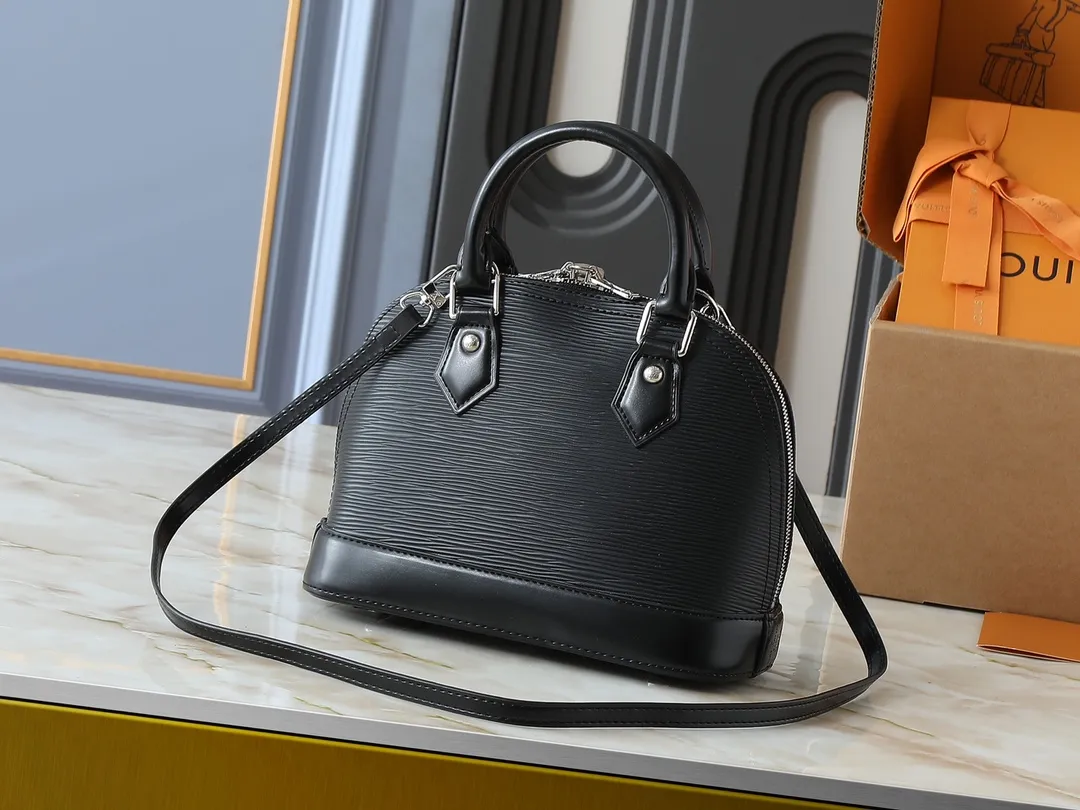 💰240💰Upgraded original M41160 M41327 M40855 M40862 M53152 This Alma BB handbag is based on a classic Louis Vuitton bag designed in 1934 with an Art Deco style. In 2010, on the occasion of the 20th anniversary of the official launch of the Alma bag, a mini model was specially designed for the daughter of the woman who owns this bag. The Alma BB bag features a removable shoulder strap for lightweight cross-body wear. A new and stylish take on a classic shape, this bag in Epi leather is available in a range of bright, vibrant colors. Size: 25×19×12cm
