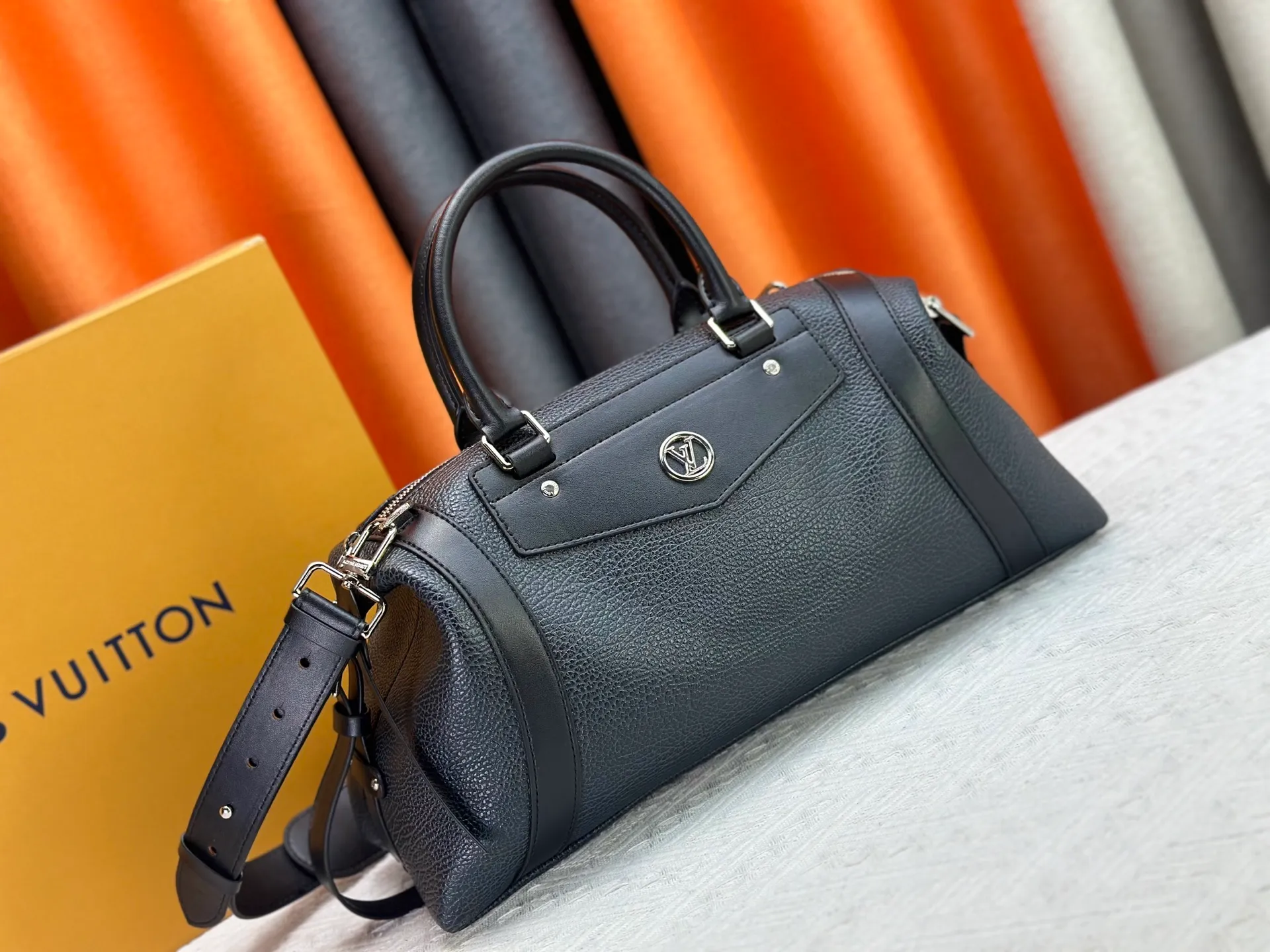 P300 small P320 medium P340 large M25557 M25561 M25561 M25566 Black M14623 mini M14514 small M14700 medium Dark gray M14702 medium Light gray M14721 small This Nano LV Rider handbag is from 2025 For the spring and summer series, pixelated grained sheep leather is blended with smooth cow leather elements, and the LV Circle logo is highlighted with elegant patches. The foldable configuration makes it easy to store in a suitcase, and the modern design adds a rock-n-roll edge to any look.  Mini 10 x 10 x 23 cm Small 12 × 12 × 30 cm Medium 15 × 15 × 38 cm (H x W x L) Sheep leather Cow leather trim Textile lining Metal hardware Zipper closure Side slip straps Internal pocket Holds a 6.7-inch smartphone, Romy card holder and lipstick Shoulder strap: removable, adjustable Strap half-length: 30.0 cm Bag strap half length adjustable to: 45.0 cm Handle: double handle