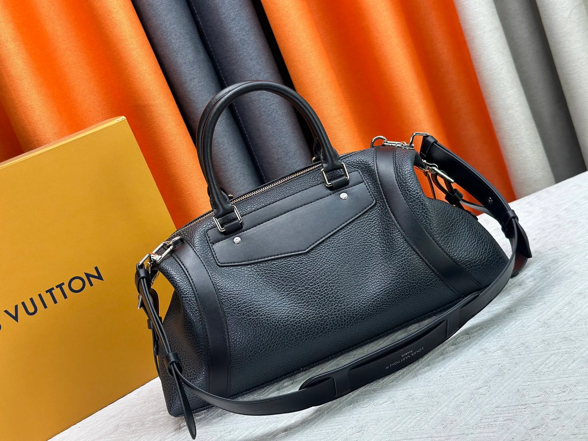 P300 small P320 medium P340 large M25557 M25561 M25561 M25566 Black M14623 mini M14514 small M14700 medium Dark gray M14702 medium Light gray M14721 small This Nano LV Rider handbag is from 2025 For the spring and summer series, pixelated grained sheep leather is blended with smooth cow leather elements, and the LV Circle logo is highlighted with elegant patches. The foldable configuration makes it easy to store in a suitcase, and the modern design adds a rock-n-roll edge to any look.  Mini 10 x 10 x 23 cm Small 12 × 12 × 30 cm Medium 15 × 15 × 38 cm (H x W x L) Sheep leather Cow leather trim Textile lining Metal hardware Zipper closure Side slip straps Internal pocket Holds a 6.7-inch smartphone, Romy card holder and lipstick Shoulder strap: removable, adjustable Strap half-length: 30.0 cm Bag strap half length adjustable to: 45.0 cm Handle: double handle