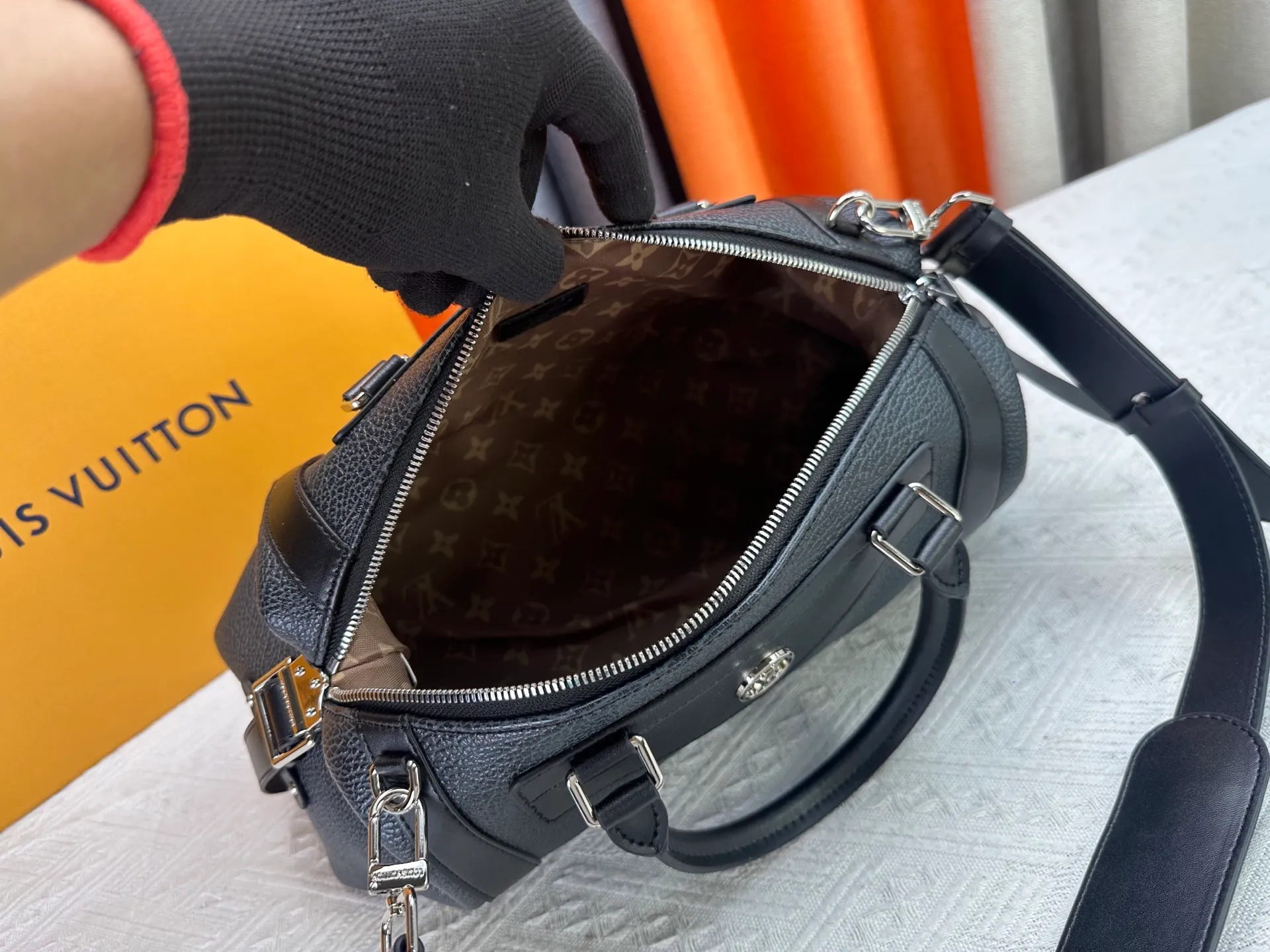 P300 small P320 medium P340 large M25557 M25561 M25561 M25566 Black M14623 mini M14514 small M14700 medium Dark gray M14702 medium Light gray M14721 small This Nano LV Rider handbag is from 2025 For the spring and summer series, pixelated grained sheep leather is blended with smooth cow leather elements, and the LV Circle logo is highlighted with elegant patches. The foldable configuration makes it easy to store in a suitcase, and the modern design adds a rock-n-roll edge to any look.  Mini 10 x 10 x 23 cm Small 12 × 12 × 30 cm Medium 15 × 15 × 38 cm (H x W x L) Sheep leather Cow leather trim Textile lining Metal hardware Zipper closure Side slip straps Internal pocket Holds a 6.7-inch smartphone, Romy card holder and lipstick Shoulder strap: removable, adjustable Strap half-length: 30.0 cm Bag strap half length adjustable to: 45.0 cm Handle: double handle