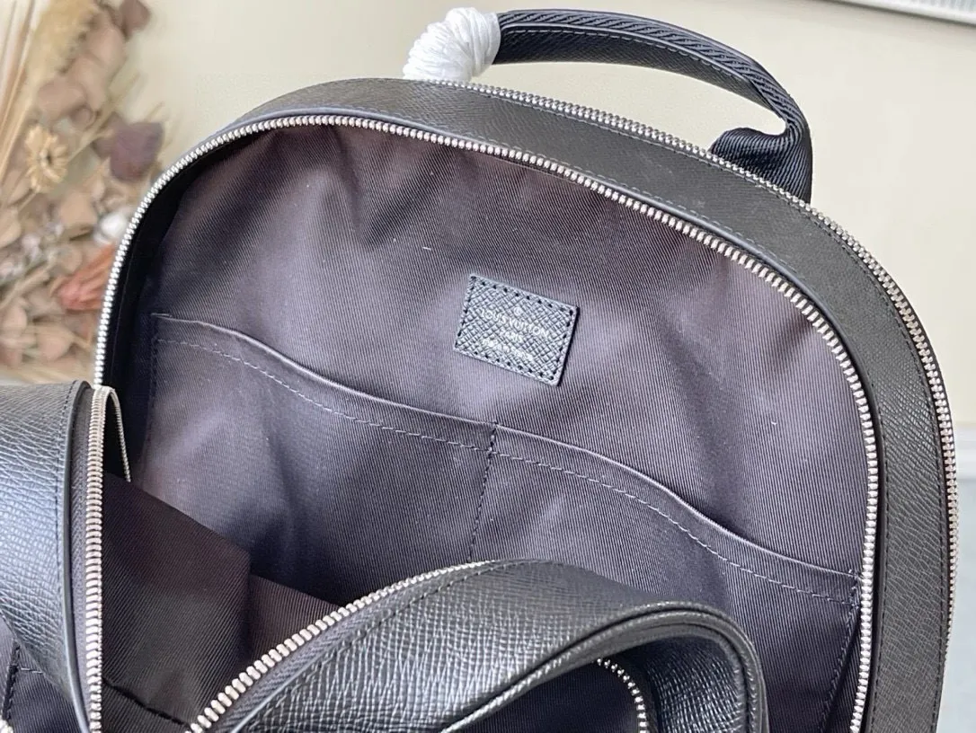 💰1080 (top-grain leather) top quality original M30857 black (grey) ADRIAN Backpack Adrian Backpack is made of Taïga leather with plenty of space and a padded compartment to store a laptop. Cross-pattern double-layered messenger men's backpack has a delicate texture and a modern style. The outer pockets and zippers add functional details, and the handles and adjustable shoulder straps allow for multiple carrying methods. Dimensions: 31 x 39 x 14 cm
